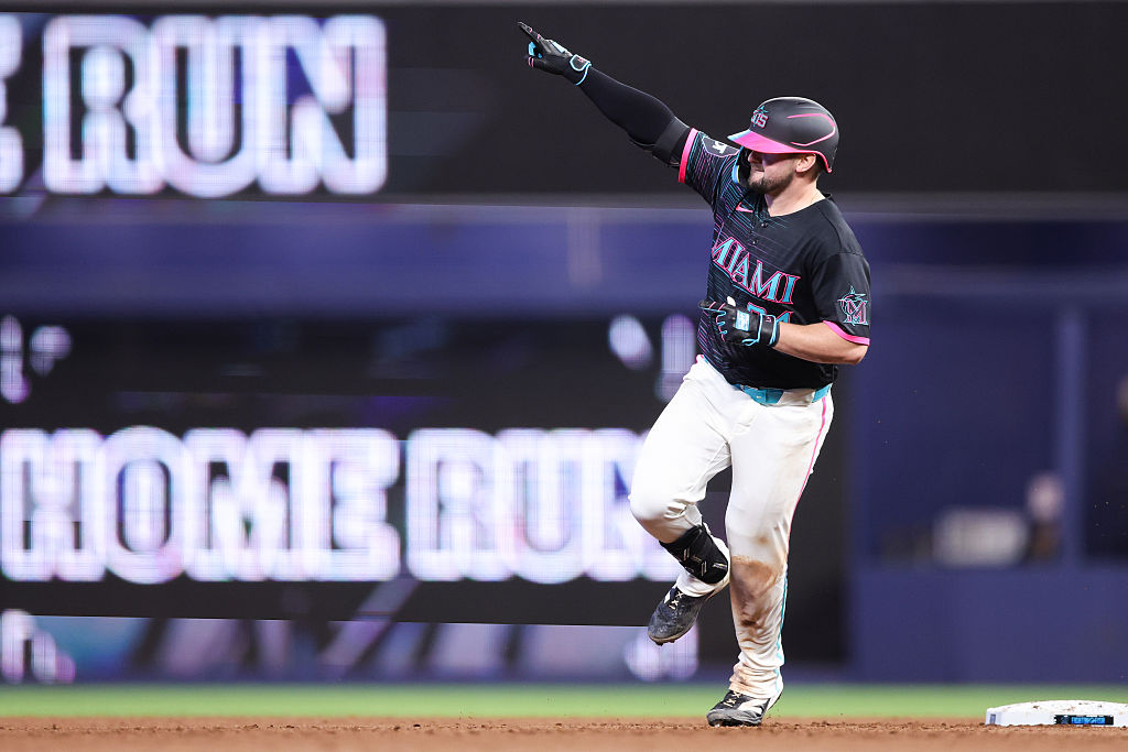 Liam Hicks #34 of the Miami Marlins rounds second base after hitting a two-run home run against the Colorado Rockies in the fifth inning