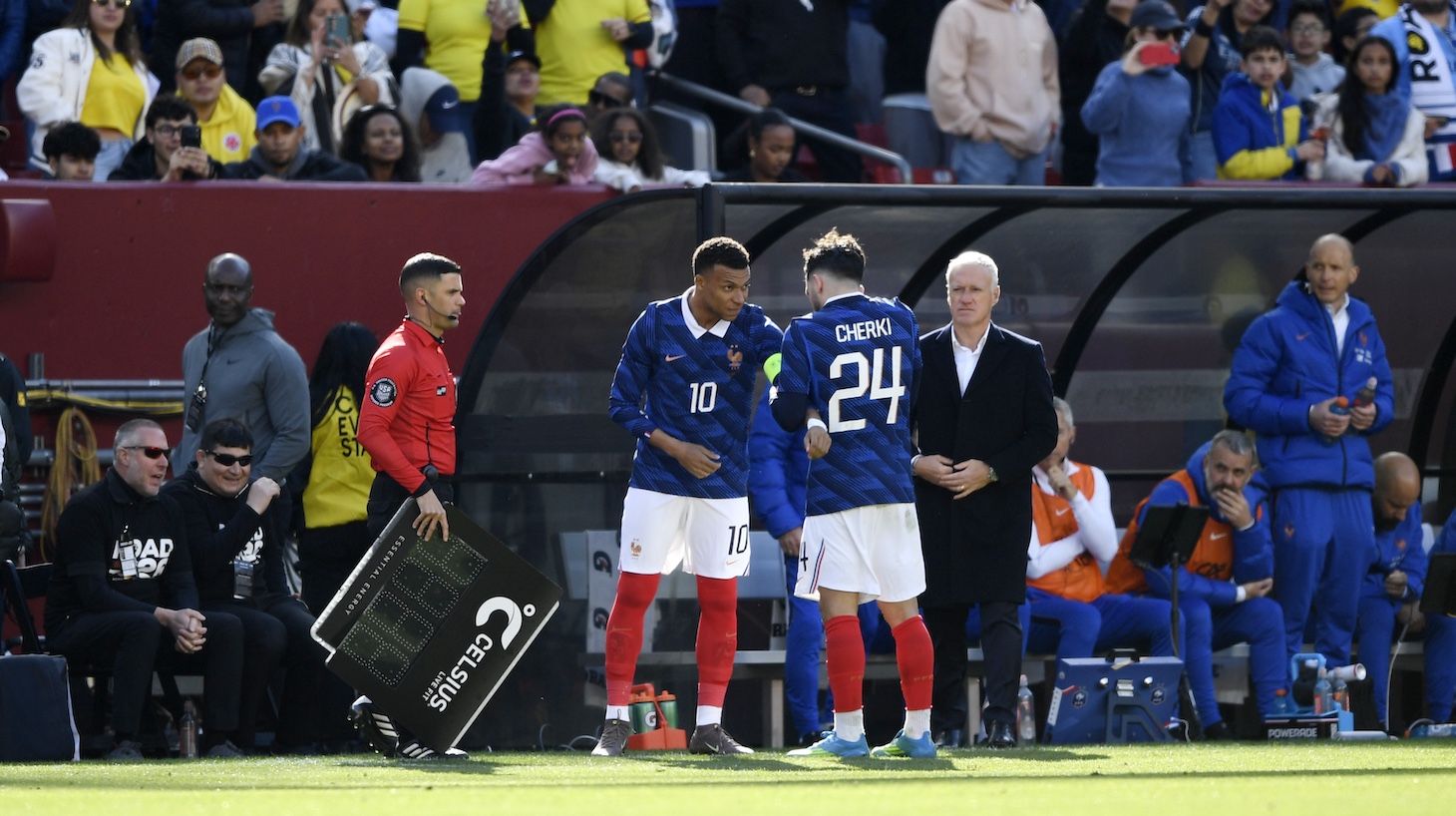 Rayan Cherki of France gives the captain's armband to teammate Kylian Mbappe during the international friendly match between Colombia and France at Northwest Stadium on March 29, 2026 in Landover, Maryland.
