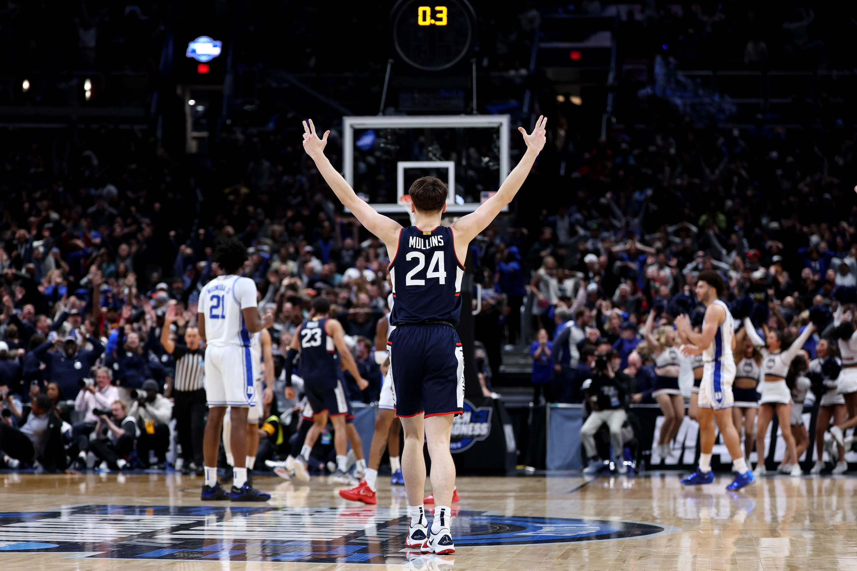 Braylon Mullins of the UConn Huskies celebrates after hitting the game-winner against Duke.