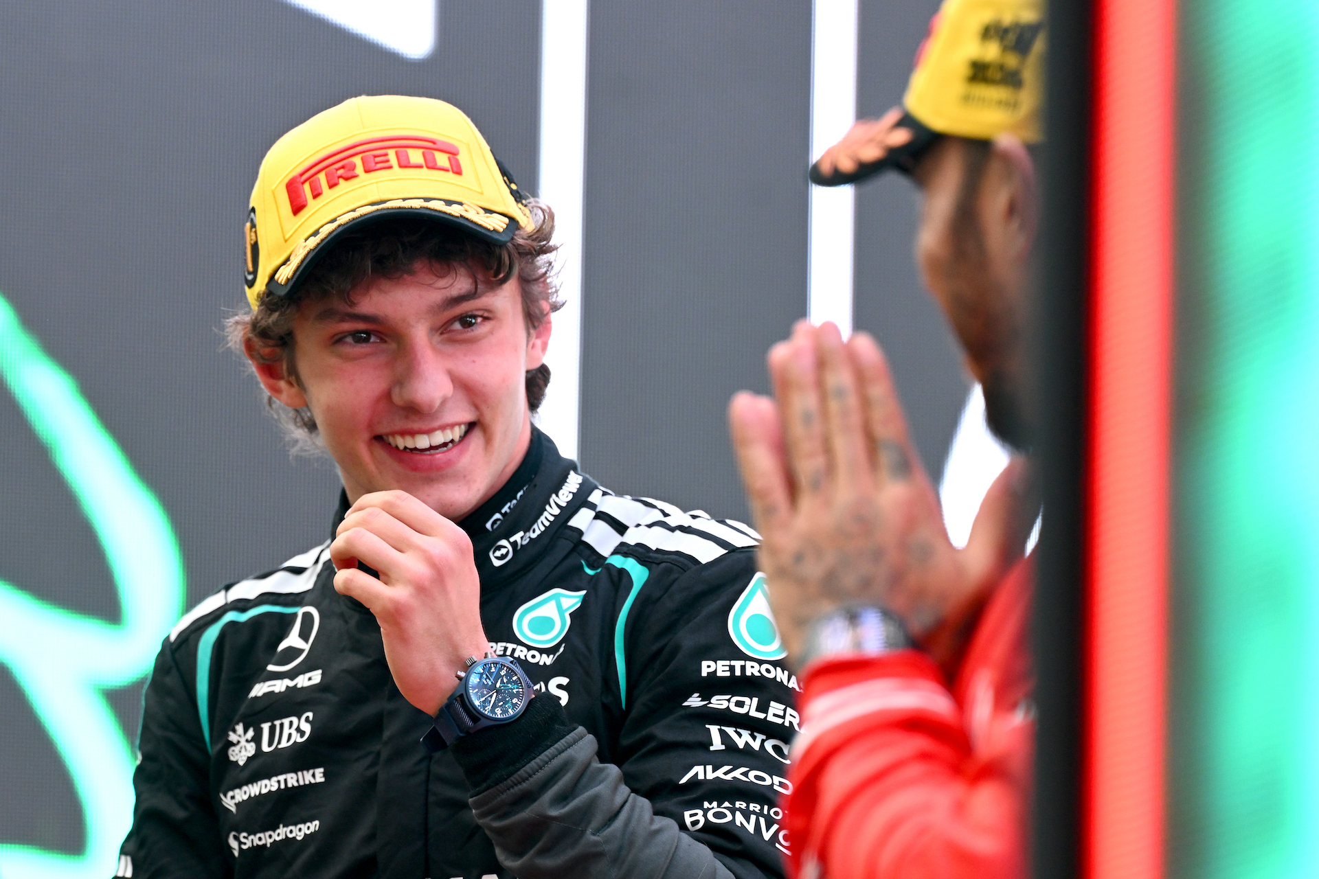 Race winner Andrea Kimi Antonelli of Italy and Mercedes AMG Petronas F1 Team and Third placed Lewis Hamilton of Great Britain and Scuderia Ferrari talk in parc ferme.