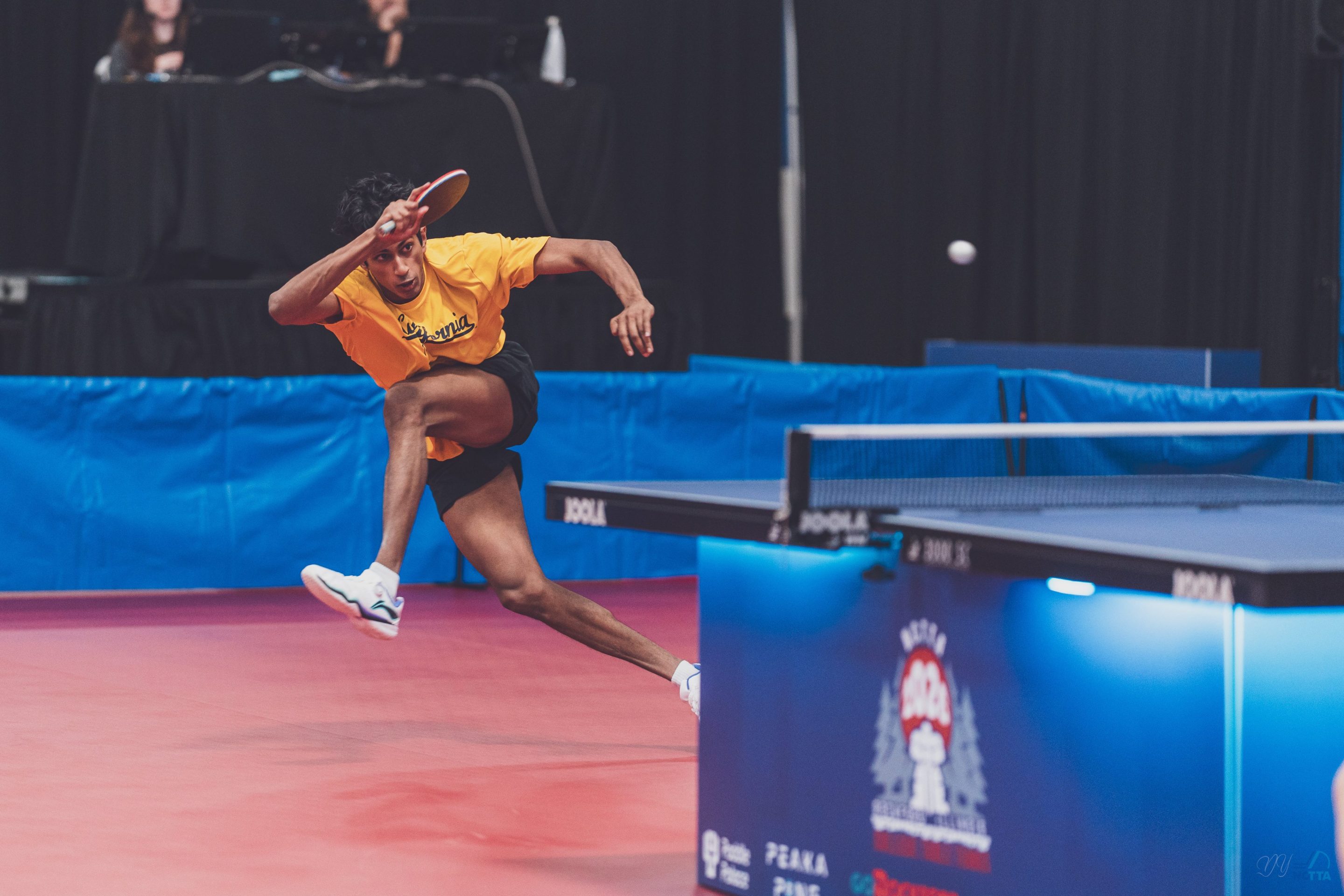 Berkeley's Sid Naresh hits a forehand on the move.