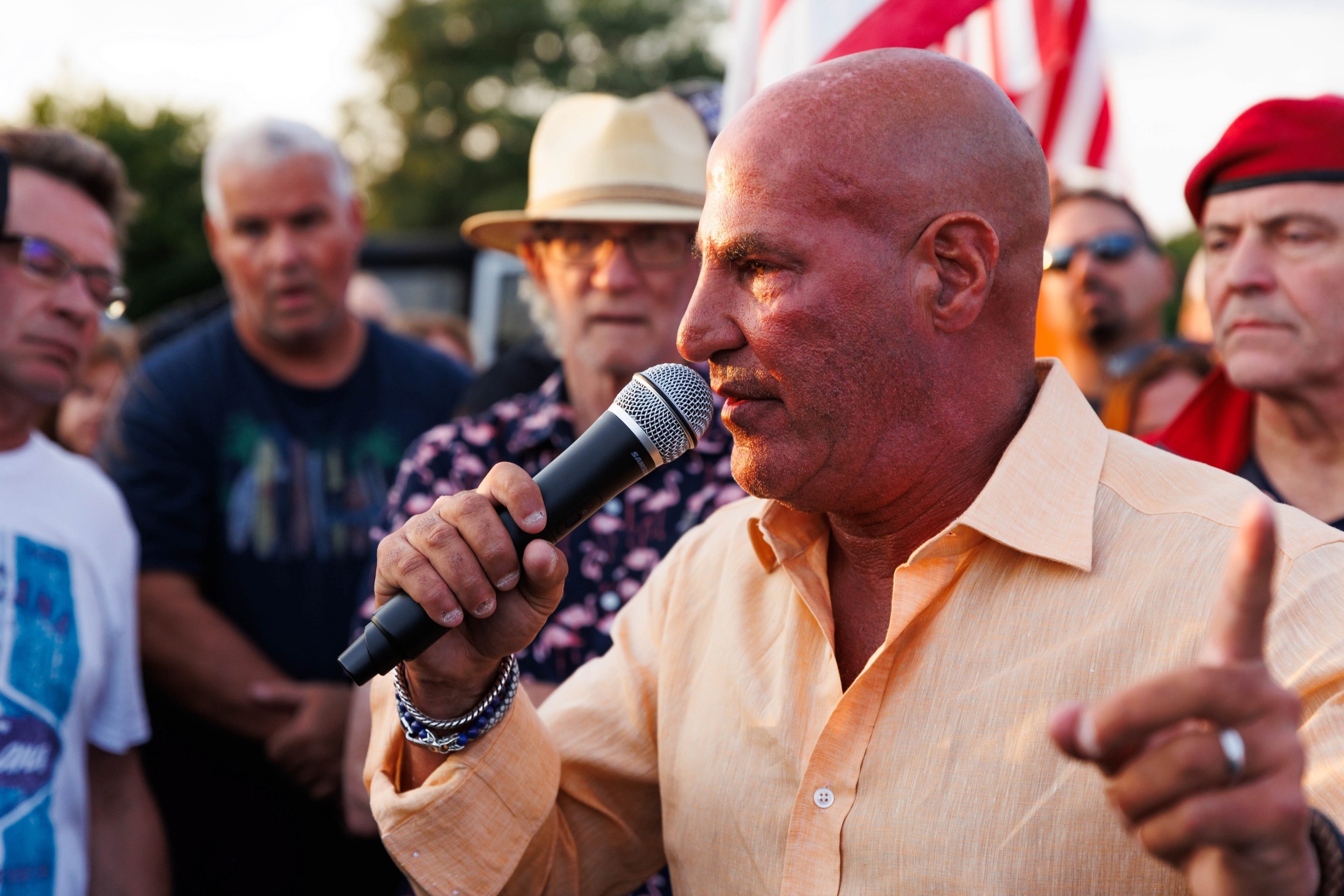 WABC radio host Sid Rosenberg speaks during a protest against a tent shelter for migrants at Floyd Bennett Field in the Brooklyn borough of New York City on August 22, 2023. They're rallying against immigrants being housed there so everyone in the picture looks like someone who'd do that.