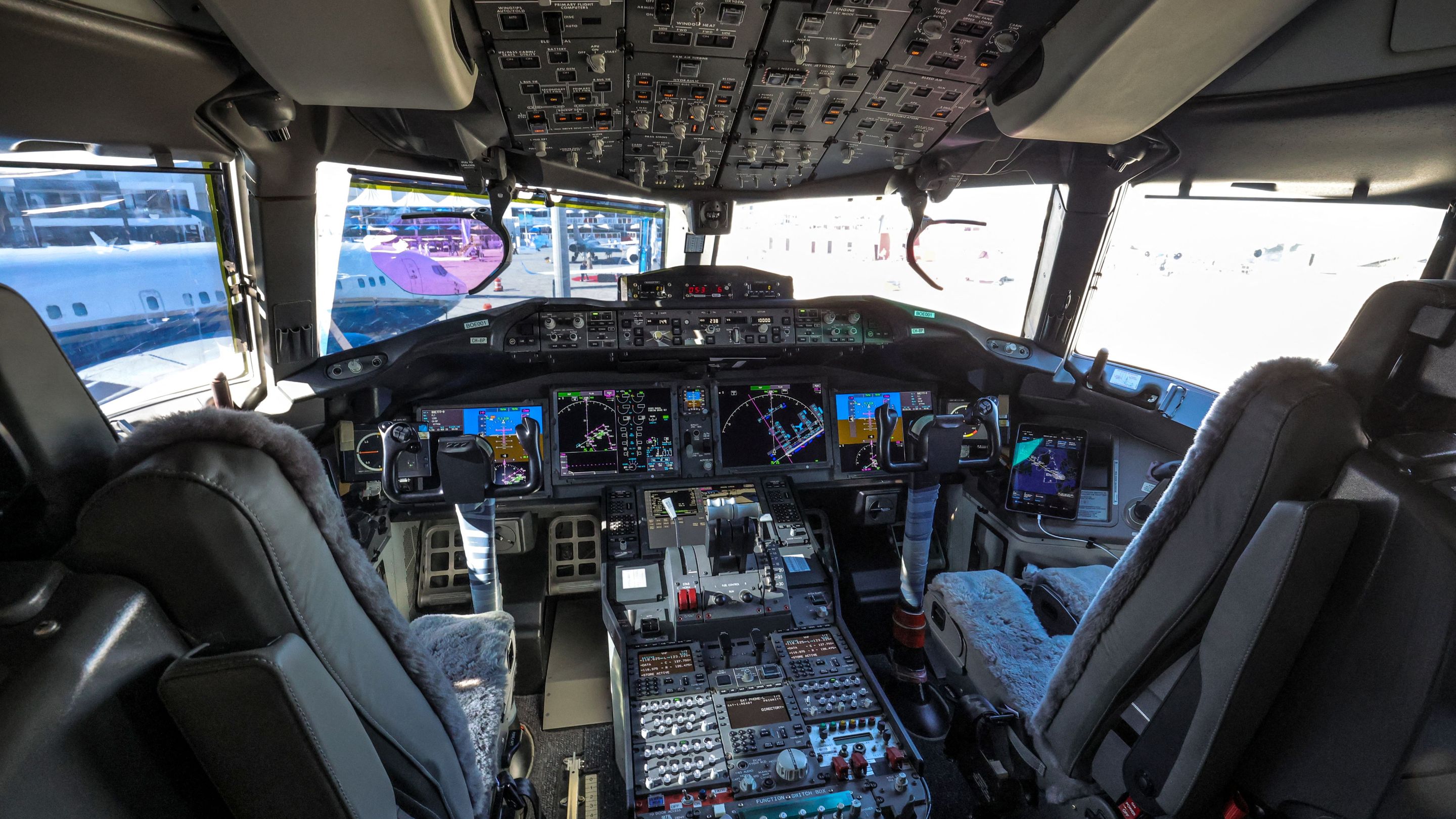 This picture taken on November 13, 2023 shows a view of interior of the pilot cockpit and flight deck of a Boeing 777-9 jetliner aircraft