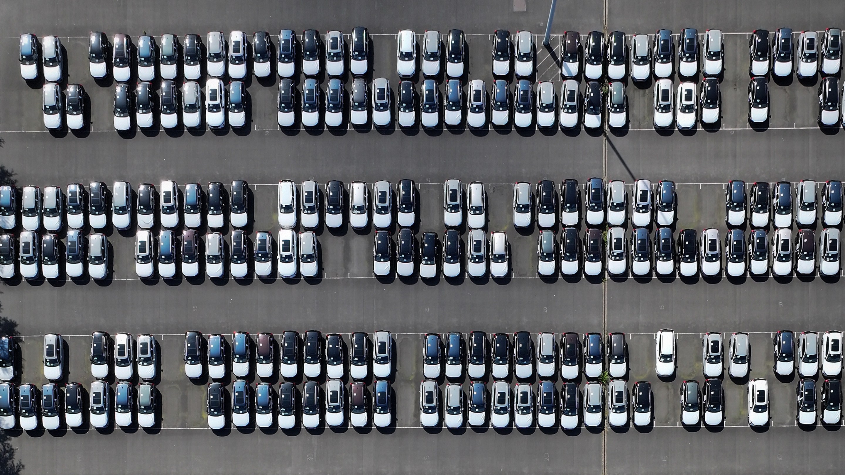 GRIMSBY, ENGLAND - JUNE 28: An aerial view of imported new cars on the quayside of Alexandra Dock at Grimsby Port on June 28, 2025 in Grimsby, England. (Photo by Christopher Furlong/Getty Images)