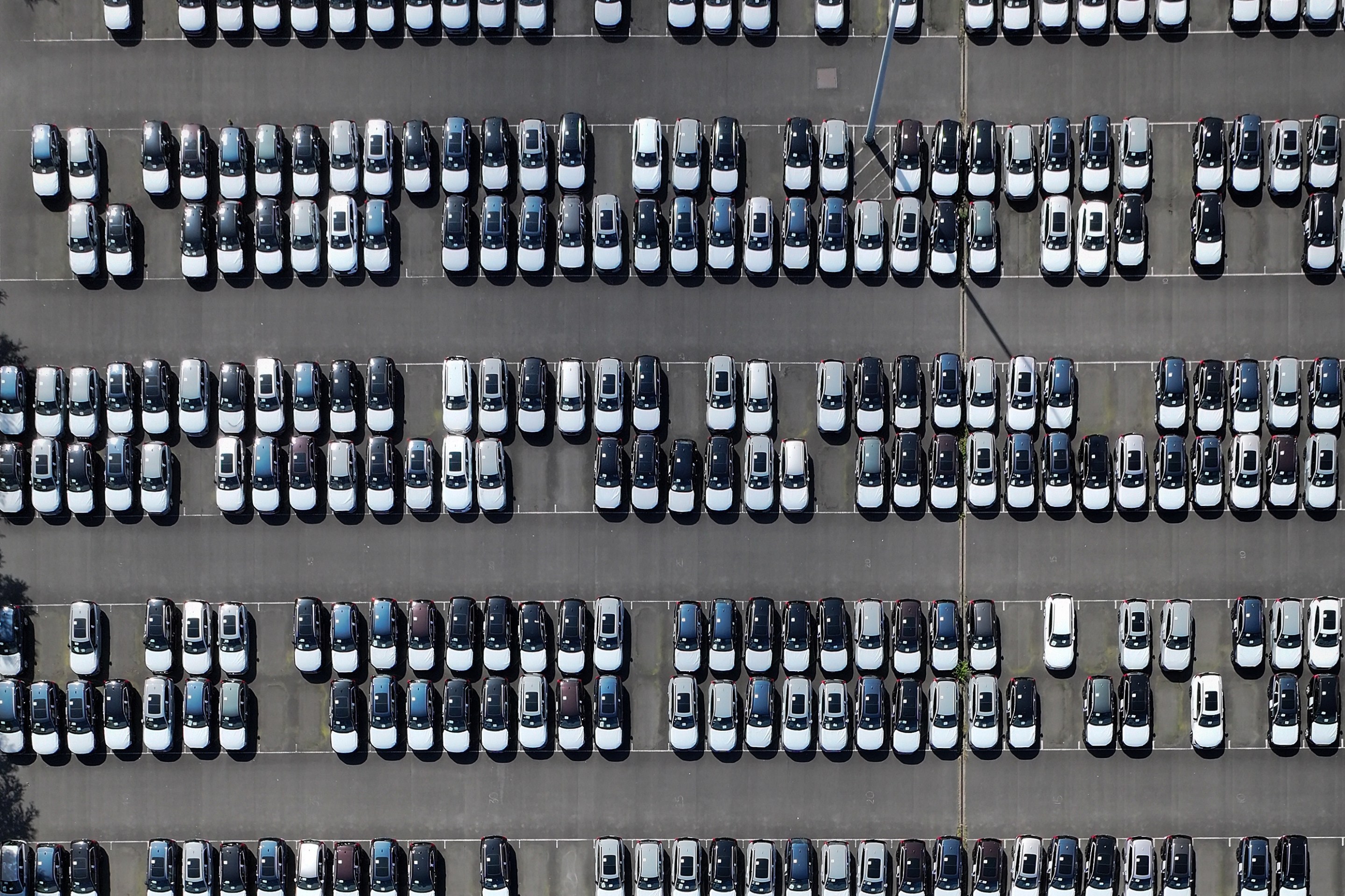 GRIMSBY, ENGLAND - JUNE 28: An aerial view of imported new cars on the quayside of Alexandra Dock at Grimsby Port on June 28, 2025 in Grimsby, England. (Photo by Christopher Furlong/Getty Images)