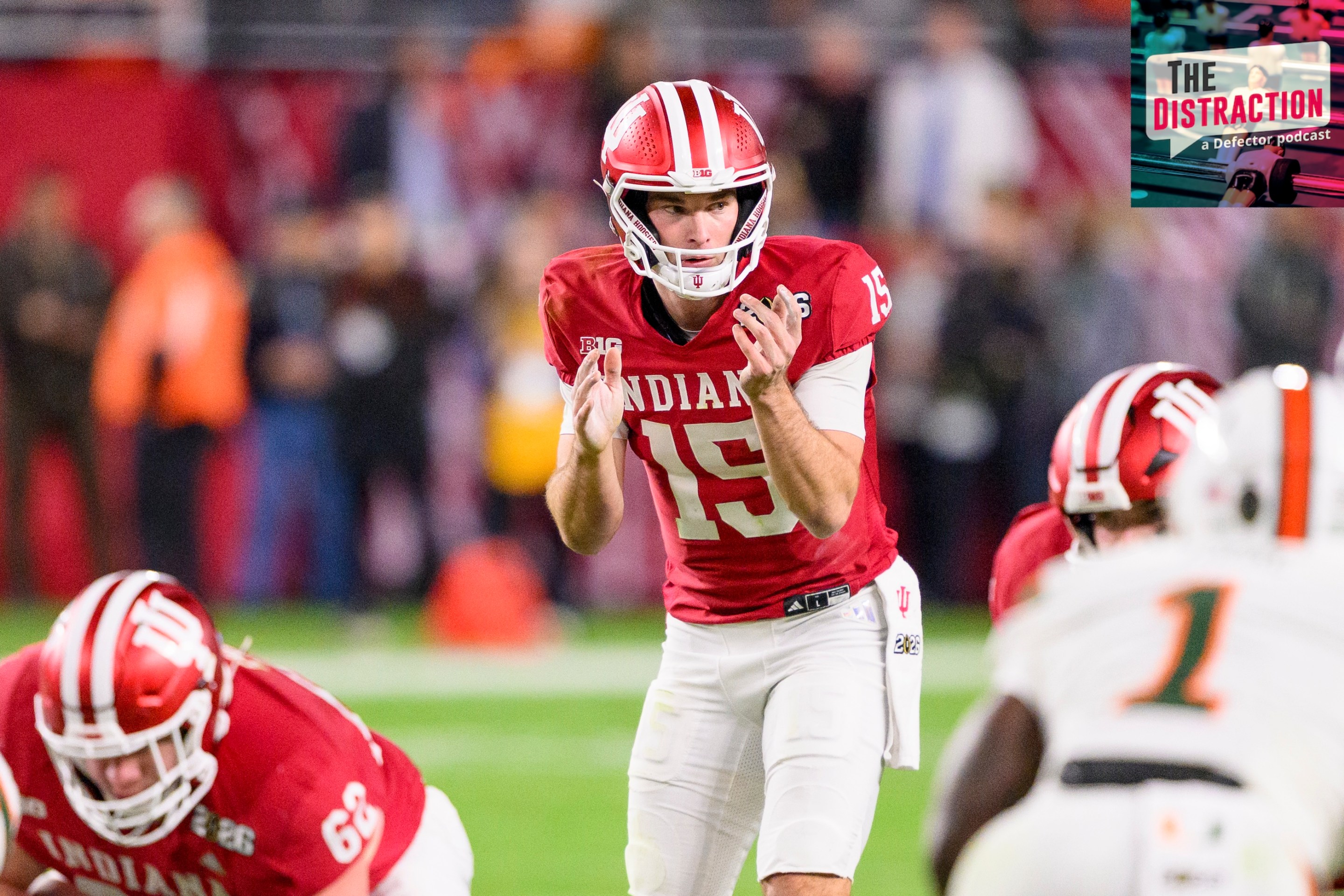 Fernando Mendoza of the Indiana Hoosiers prepares to take the snap of the ball at the line of scrimmage during the Indiana Hoosiers versus the Miami Hurricanes College Football Playoff National Championship Game.