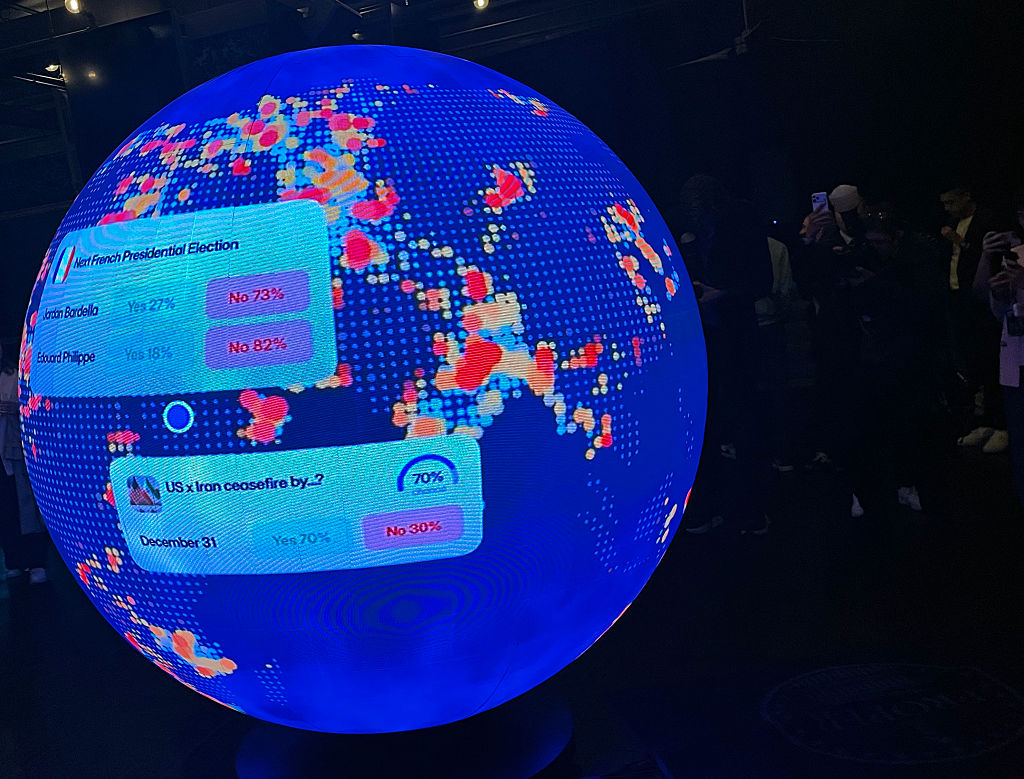 A LED sphere screen shows information inside the new location of the prediction market online platform Polymarket called "The Situation Room."