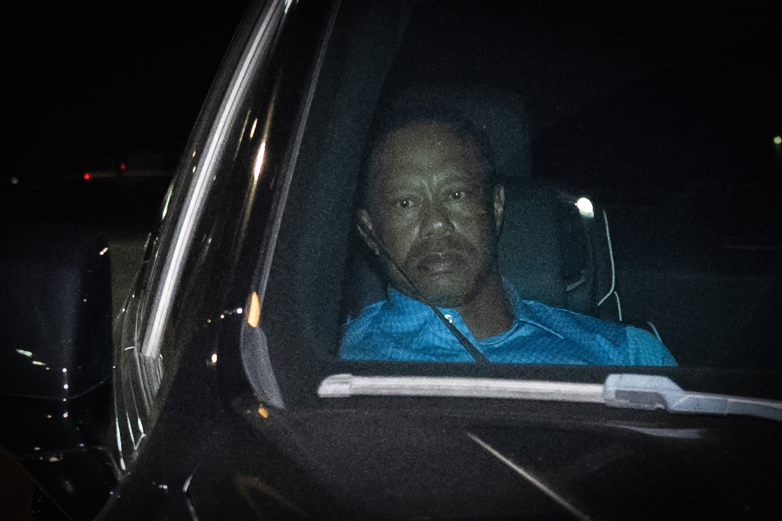 Tiger Woods is seen leaving Martin County Jail in the back of an SUV.