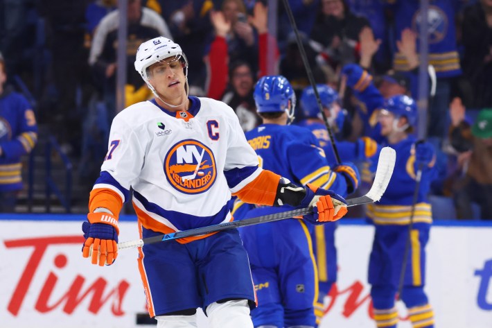 Anders Lee #27 of the New York Islanders reacts following Bowen Byram #4 of the Buffalo Sabres scoring an empty net goal