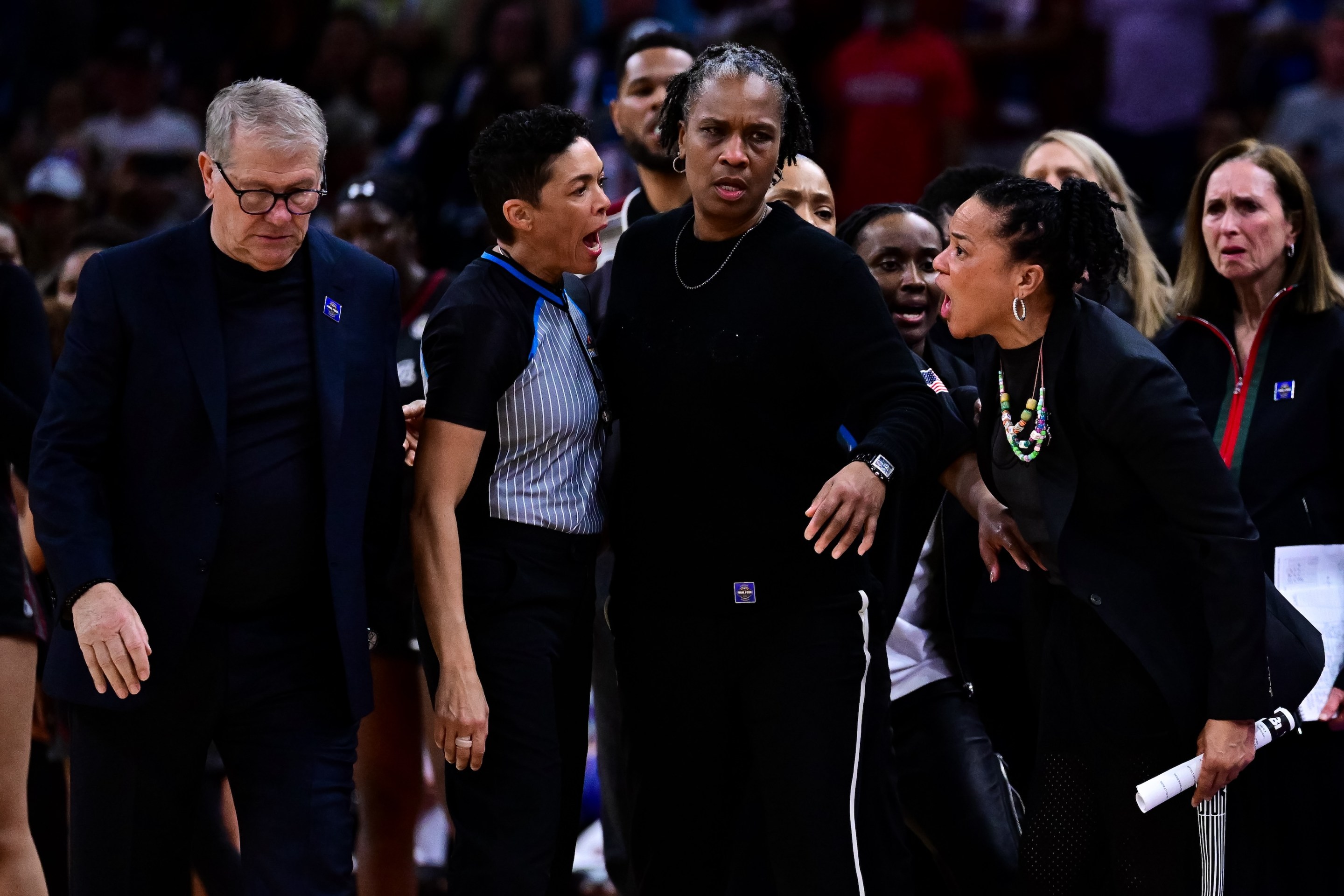 Dawn Staley of the South Carolina Gamecocks argues with Geno Auriemma of the UConn Huskies during the second half of a NCAA Women's Final Four semifinal game on April 3, 2026.