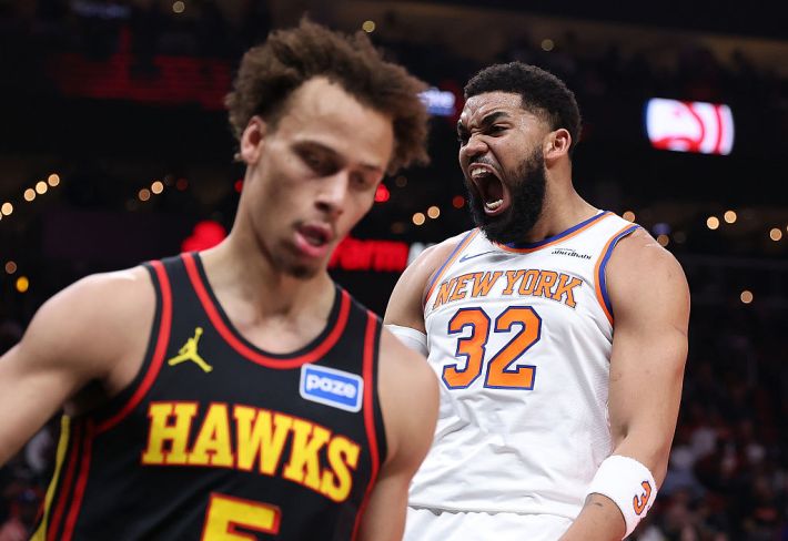 Karl-Anthony Towns #32 of the New York Knicks reacts after dunking against Dyson Daniels #5 of the Atlanta Hawks