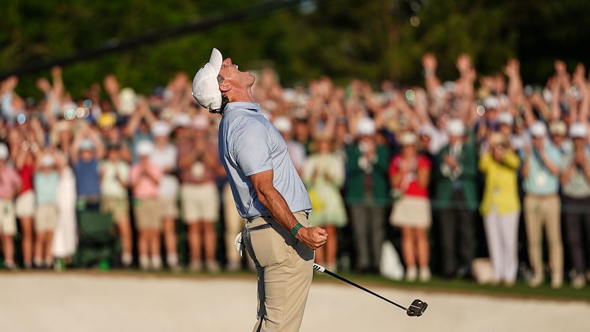 Rory McIlroy of Northern Ireland reacts to making the winning putt, on the 18th green, during the final round of Masters Tournament