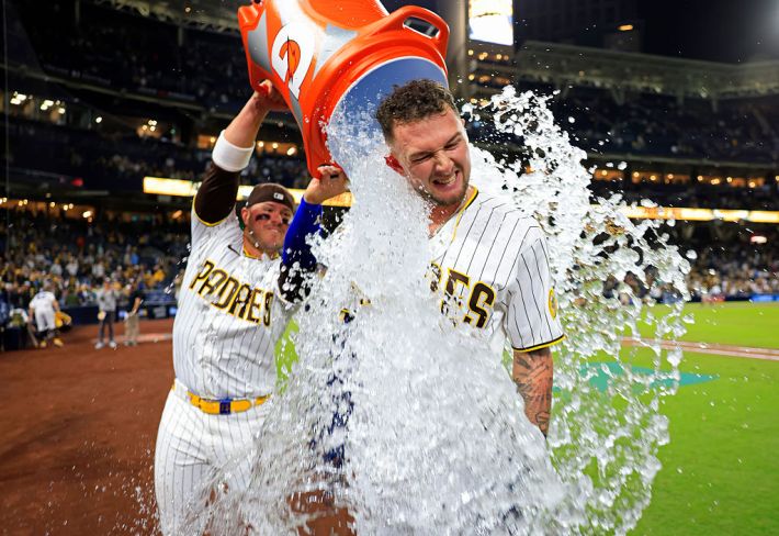 ice and water are dumped over Jackson Merrill's shoulder while he smiles