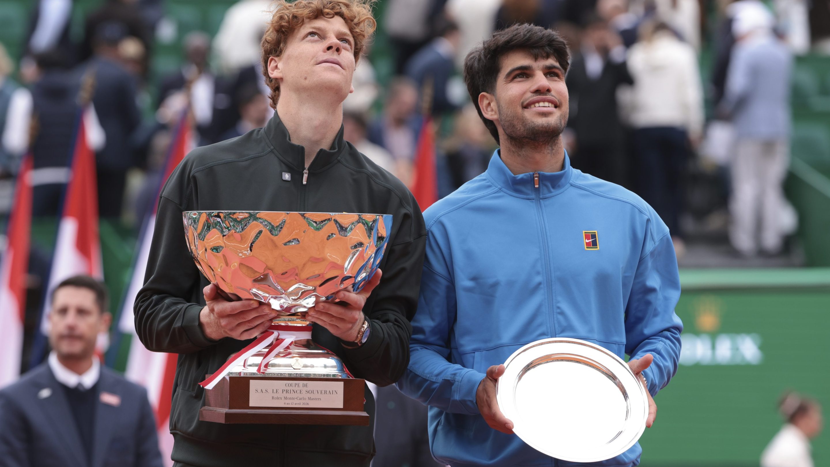 Winner Jannik Sinner of Italy and finalist Carlos Alcaraz of Spain during the trophy ceremony of the Men's Final on day 8 of the Rolex Monte-Carlo Masters 2026, an ATP Masters 1000 at Monte-Carlo Country Club on April 12, 2026 in Roquebrune-Cap-Martin, France near Monte-Carlo, Monaco. (Photo by Jean Catuffe/Getty Images)