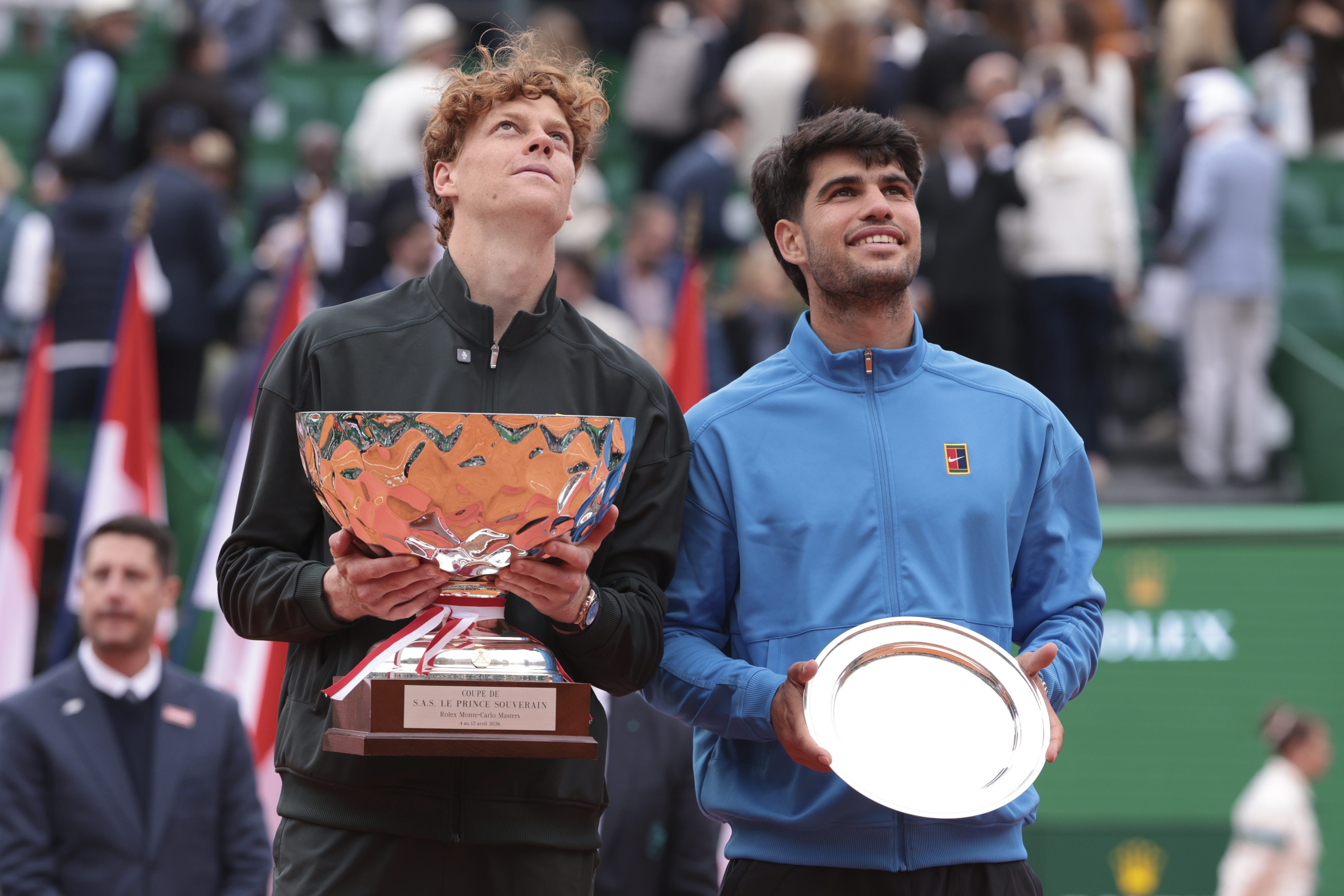 Winner Jannik Sinner of Italy and finalist Carlos Alcaraz of Spain during the trophy ceremony of the Men's Final on day 8 of the Rolex Monte-Carlo Masters 2026, an ATP Masters 1000 at Monte-Carlo Country Club on April 12, 2026 in Roquebrune-Cap-Martin, France near Monte-Carlo, Monaco. (Photo by Jean Catuffe/Getty Images)