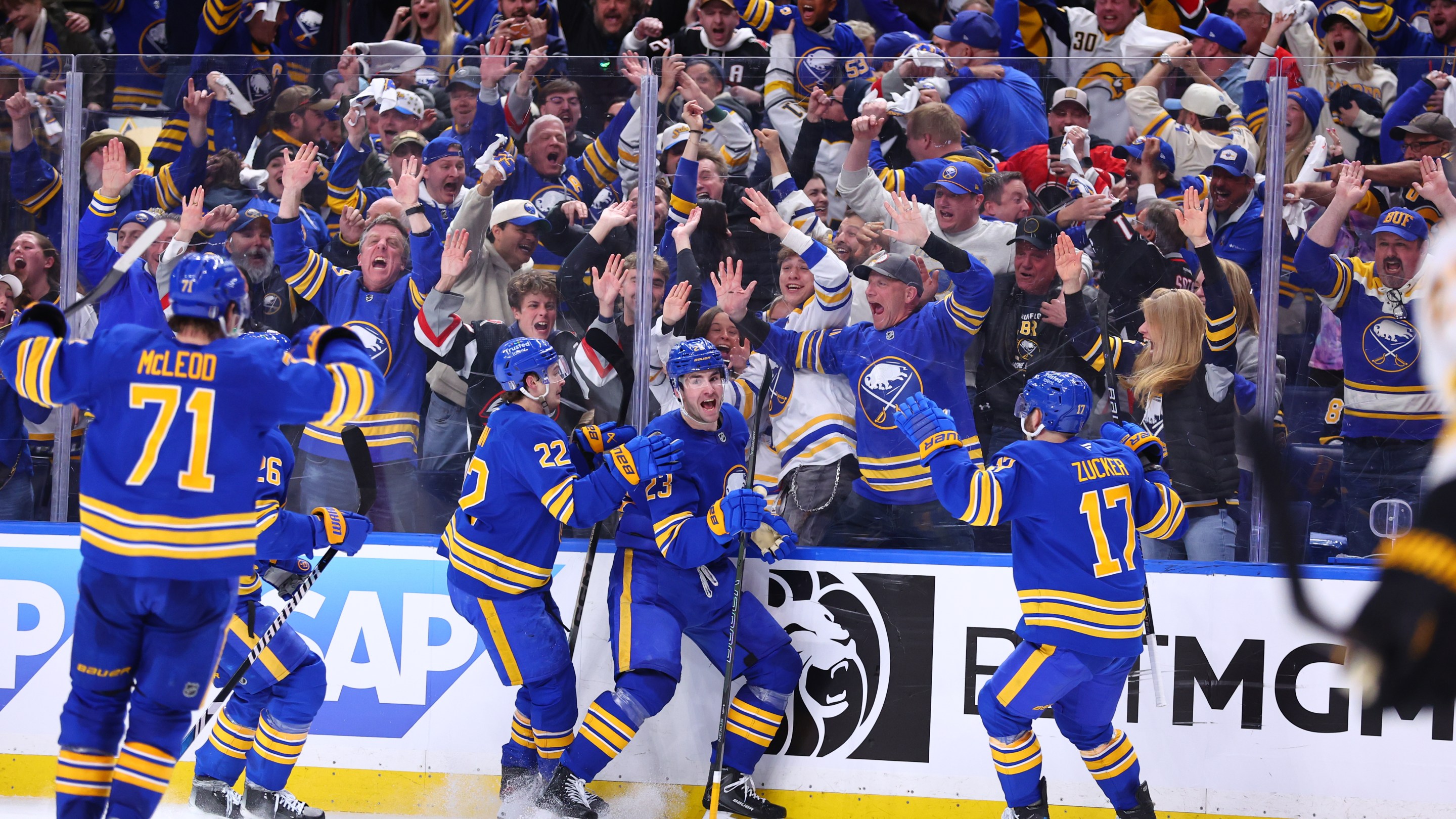 BUFFALO, NEW YORK - APRIL 19: Mattias Samuelsson #23 of the Buffalo Sabres celebrates his third period goal against the Boston Bruins with Jack Quinn #22 and Jason Zucker #17 in Game One of the First Round of the 2026 Stanley Cup Playoffs at KeyBank Center on April 19, 2026 in Buffalo, New York. (Photo by Bill Wippert/NHLI via Getty Images)