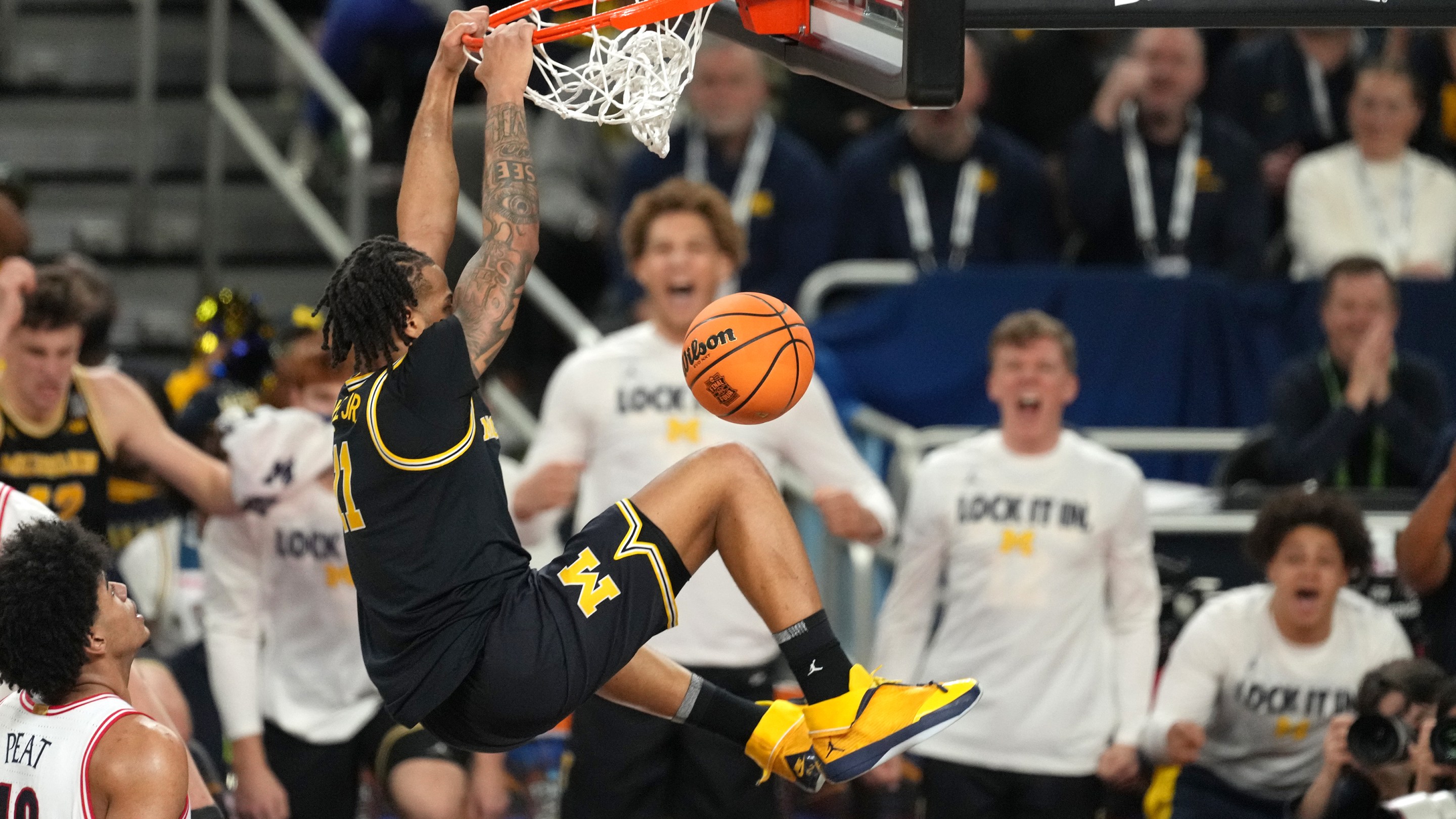 Morez Johnson Jr. of the Michigan Wolverines dunks the ball during the National Semifinal game of the 2026 NCAA Men's Basketball Tournament against the Arizona Wildcats at Lucas Oil Stadium on April 04, 2026.