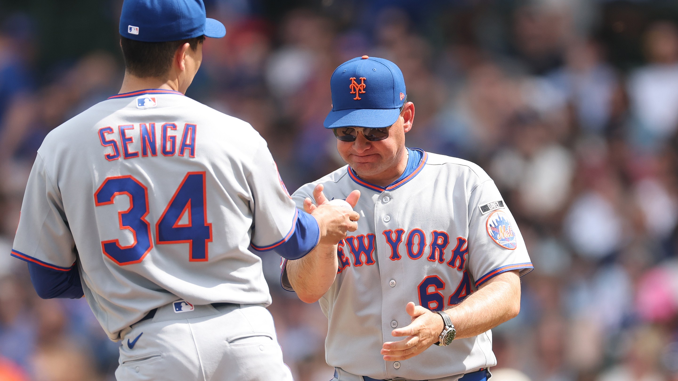 Manager Carlos Mendoza of the New York Mets removes Kodai Senga #34 from the game during the fourth inning against the Chicago Cubs at Wrigley Field on April 17, 2026 in Chicago, Illinois.