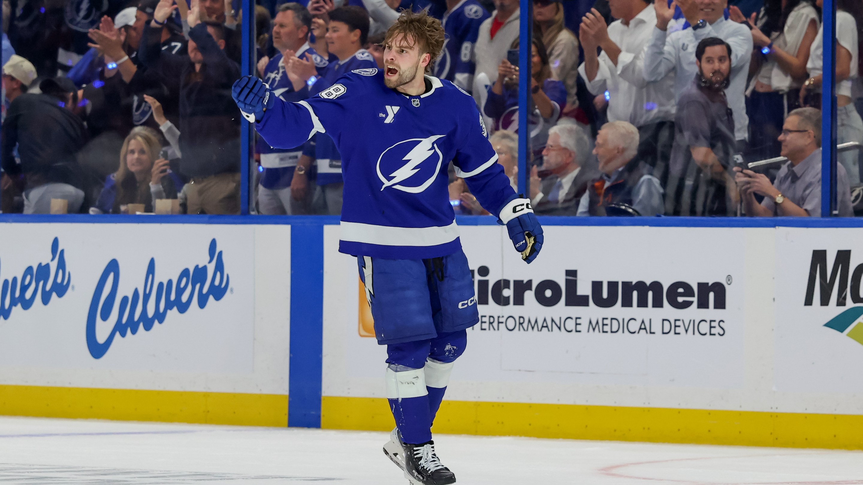Brandon Hagel #38 of the Tampa Bay Lightning cheers on the crowd as heads to the penalty box after a fight against the Montréal Canadiens