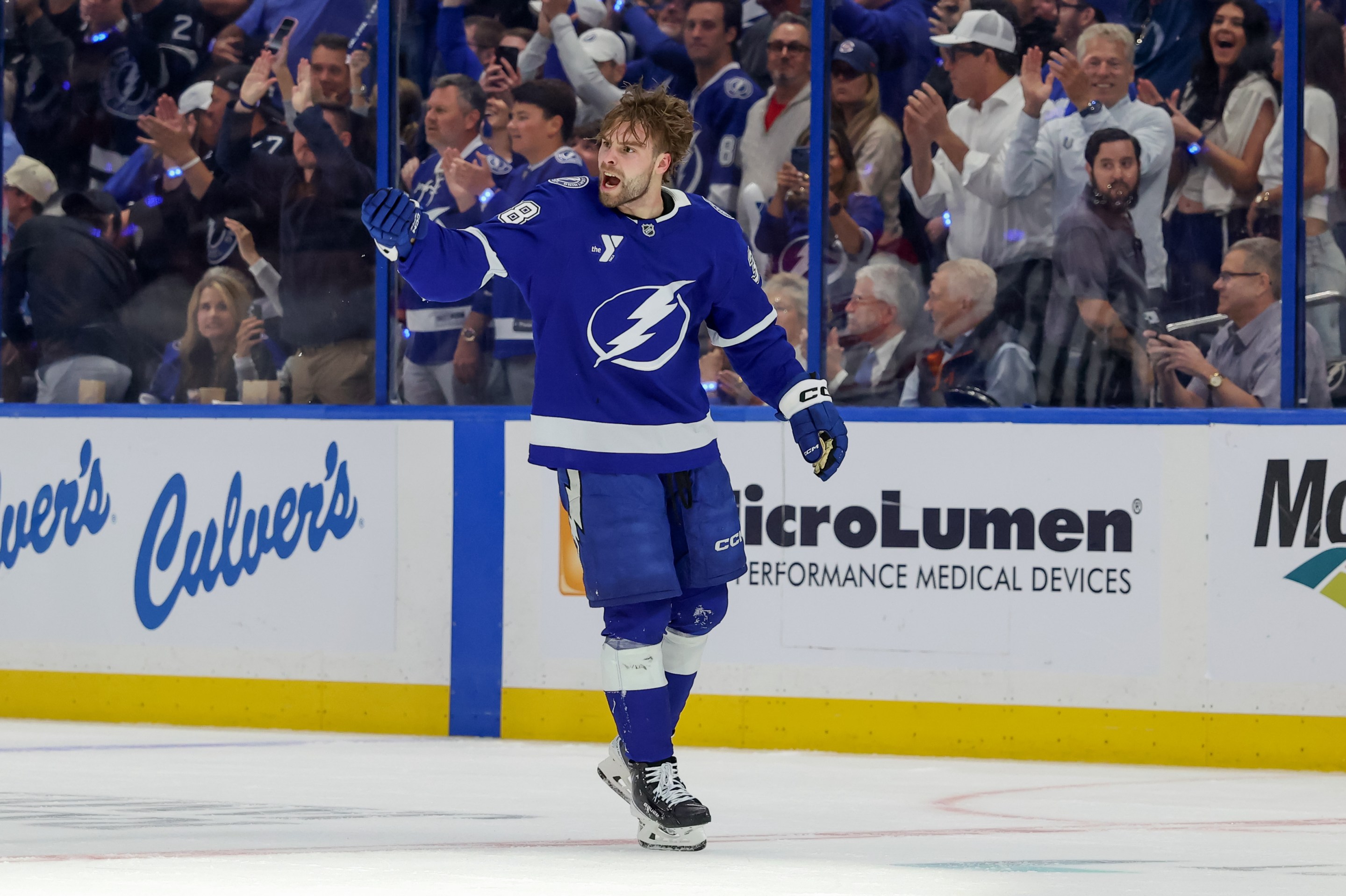 Brandon Hagel #38 of the Tampa Bay Lightning cheers on the crowd as heads to the penalty box after a fight against the Montréal Canadiens