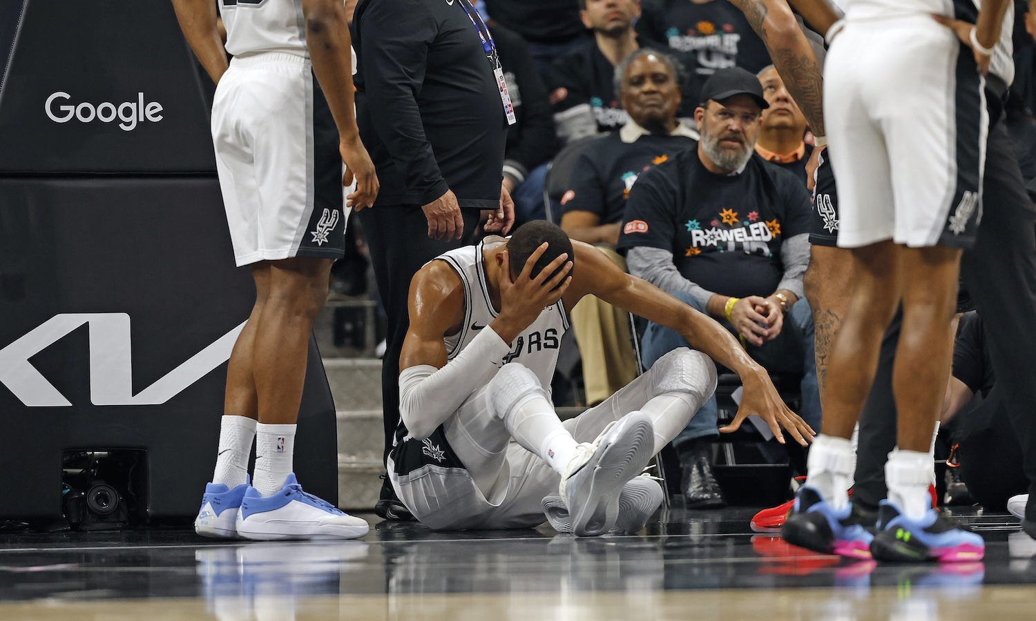 SAN ANTONIO, TX -APRIL 21: Victor Wembanyama #1 of the San Antonio Spurs holds his head after falling to the court against the Portland Trailblazers in the first half of Game Two of the Western Conference First Round NBA Playoffs at Frost Bank Center on April 21, 2026 in San Antonio, Texas. NOTE TO USER: User expressly acknowledges and agrees that, by downloading and or using this photograph, User is consenting to terms and conditions of the Getty Images License Agreement. (Photo by Ronald Cortes/Getty Images)