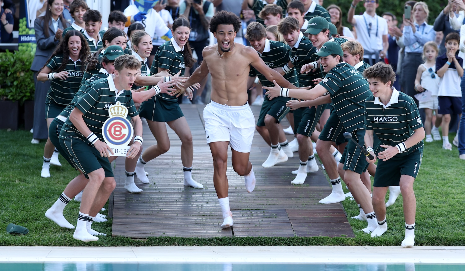BARCELONA, SPAIN - APRIL 19: Arthur Fils of France jumps into a swimming pool with members of the Ball Team following victory against Andrey Rublev (not pictured) in the Men's Singles final match on day seven of the Barcelona Open of the Barcelona Open at Real Club De Tenis Barcelona on April 19, 2026 in Barcelona, Spain. (Photo by Clive Brunskill/Getty Images)