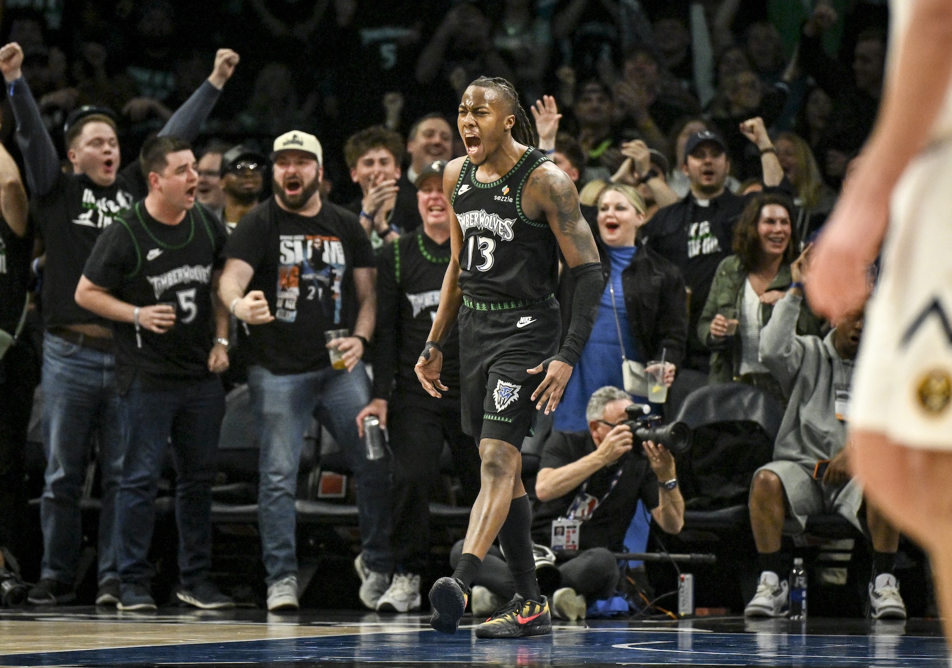 Ayo Dosunmu celebrates against the Denver Nuggets