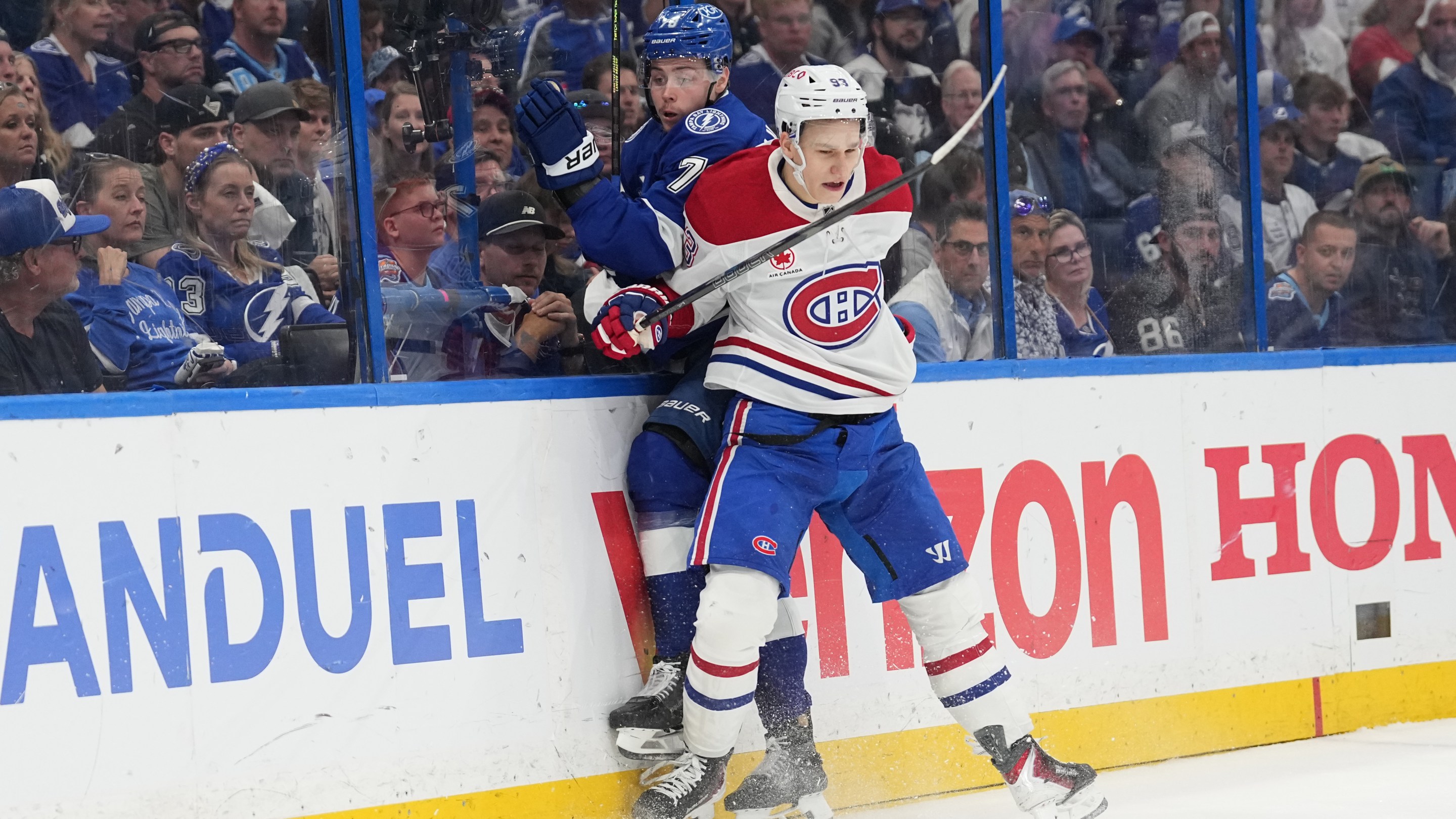 TAMPA, FL - APRIL 29: Montréal Canadiens right wing Ivan Demidov (93) checks Tampa Bay Lightning defenseman Emil Lilleberg (78) into the boards in the third period during game five of the first round playoff series between the Montreal Canadians and the Tampa Bay Lightning on Wednesday, April 29. 2026 at Benchmark Intl Arena in Tampa, FL (Photo by Peter Joneleit/Icon Sportswire via Getty Images)