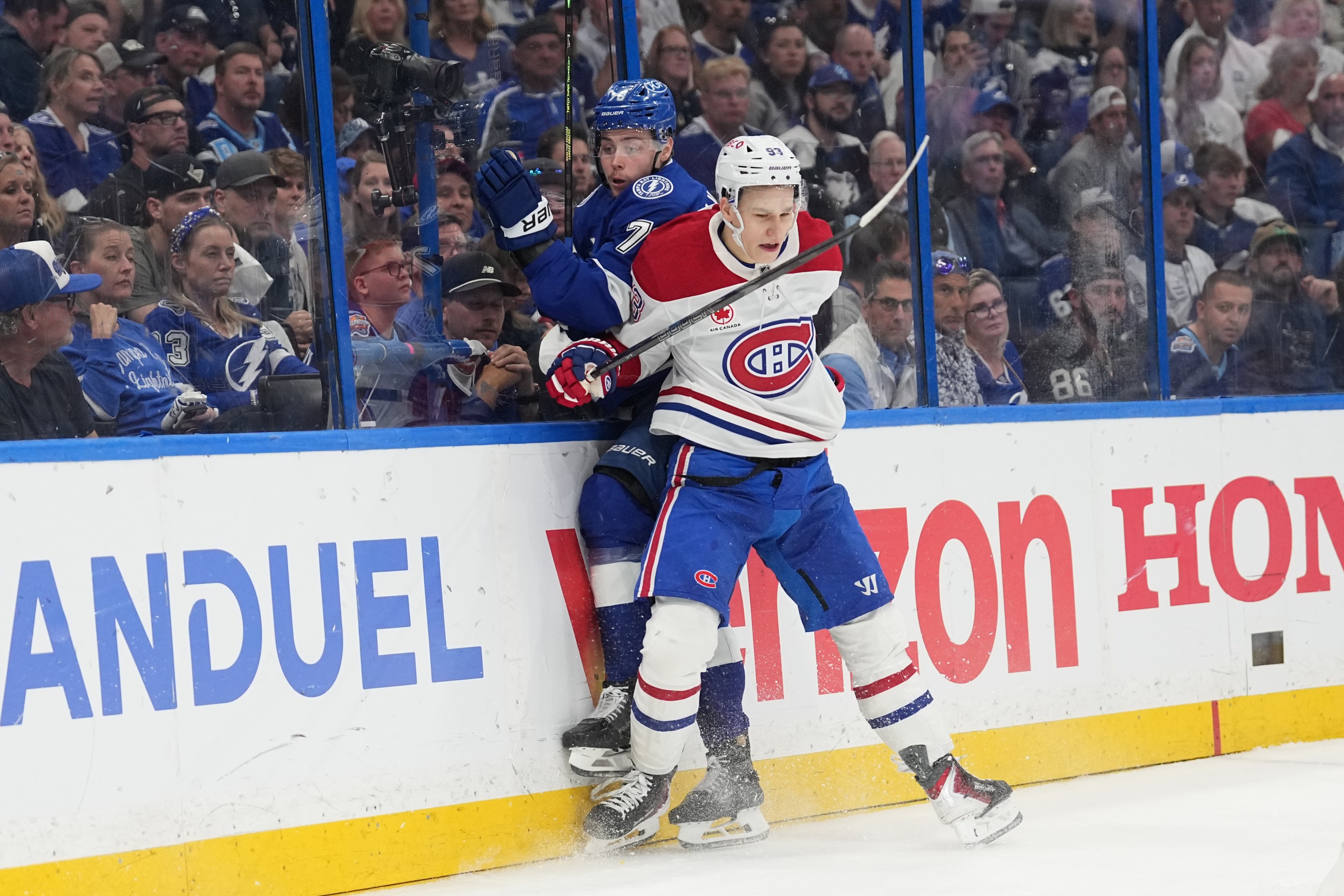 TAMPA, FL - APRIL 29: Montréal Canadiens right wing Ivan Demidov (93) checks Tampa Bay Lightning defenseman Emil Lilleberg (78) into the boards in the third period during game five of the first round playoff series between the Montreal Canadians and the Tampa Bay Lightning on Wednesday, April 29. 2026 at Benchmark Intl Arena in Tampa, FL (Photo by Peter Joneleit/Icon Sportswire via Getty Images)