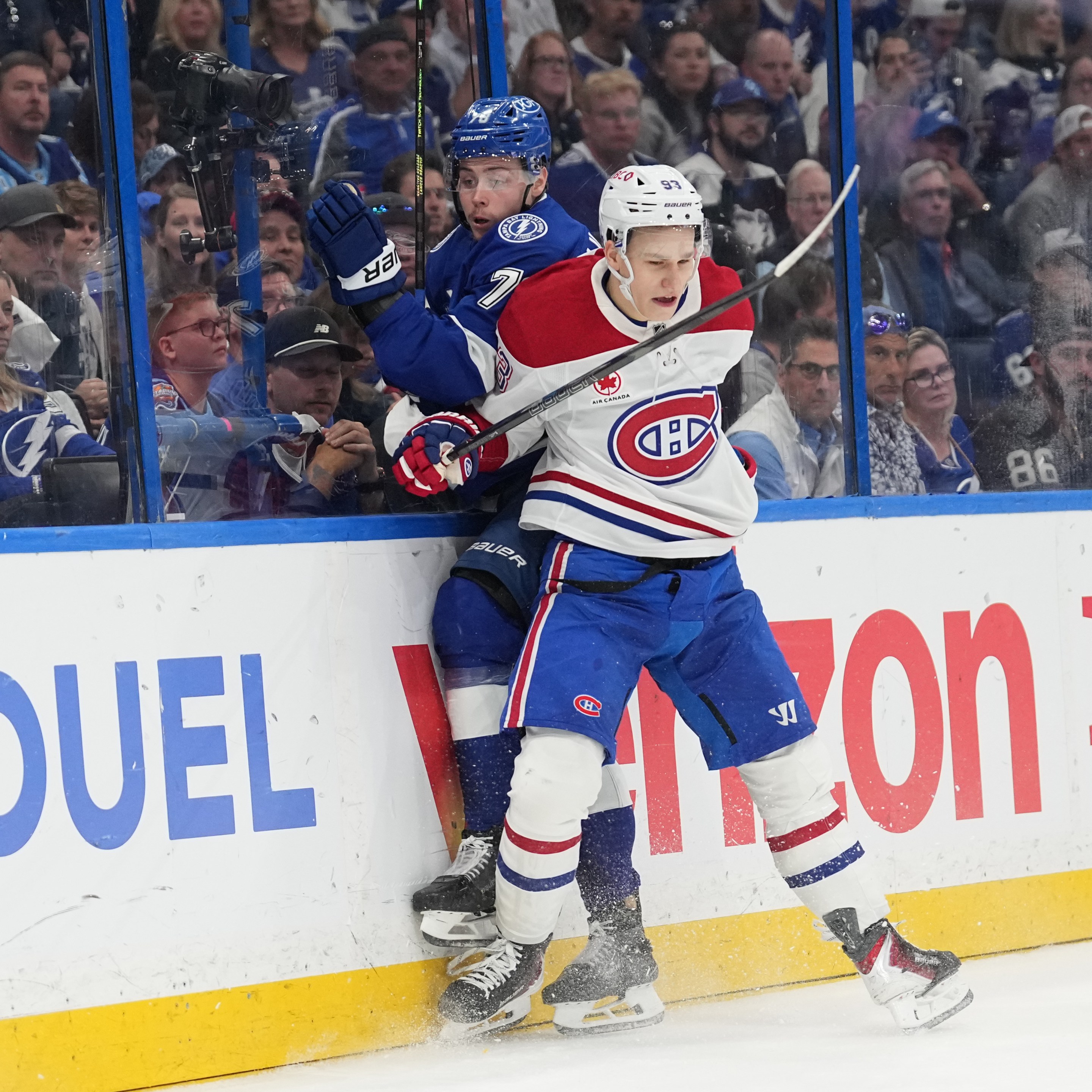 TAMPA, FL - APRIL 29: Montréal Canadiens right wing Ivan Demidov (93) checks Tampa Bay Lightning defenseman Emil Lilleberg (78) into the boards in the third period during game five of the first round playoff series between the Montreal Canadians and the Tampa Bay Lightning on Wednesday, April 29. 2026 at Benchmark Intl Arena in Tampa, FL (Photo by Peter Joneleit/Icon Sportswire via Getty Images)