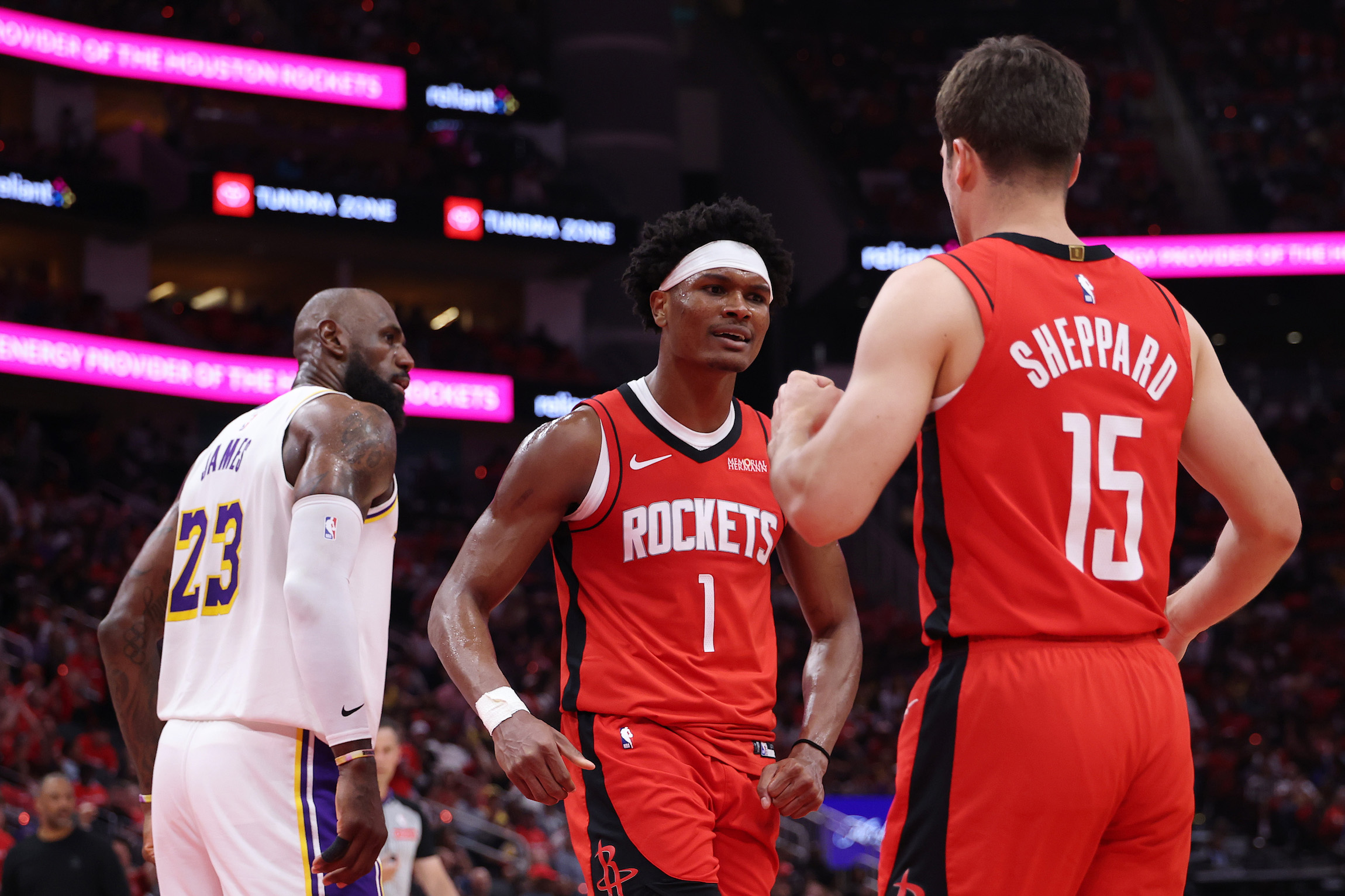 HOUSTON, TEXAS - APRIL 26: Amen Thompson #1 celebrates with Reed Sheppard #15 of the Houston Rockets as LeBron James #23 of the Los Angeles Lakers looks on during the first half in Game Four of the First Round of the NBA Western Conference Playoffs at Toyota Center on April 26, 2026 in Houston, Texas. NOTE TO USER: User expressly acknowledges and agrees that, by downloading and or using this photograph, User is consenting to the terms and conditions of the Getty Images License Agreement. (Photo by Tim Warner/Getty Images)