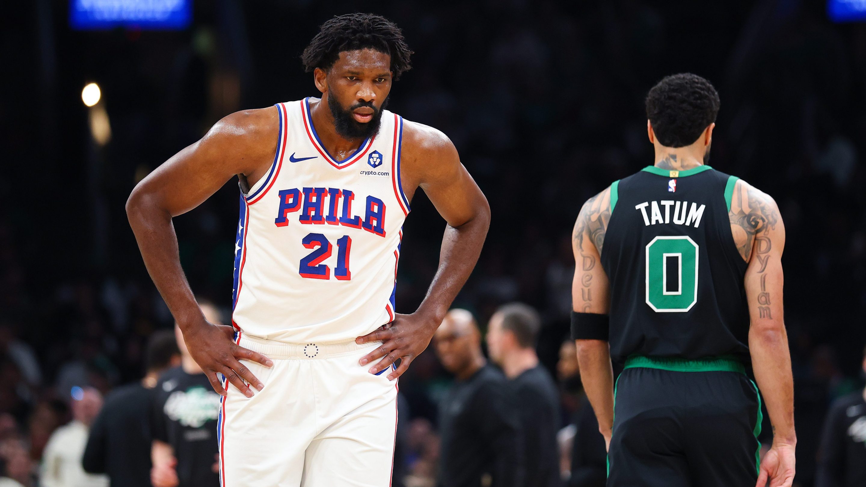 Joel Embiid #21 of the Philadelphia 76ers reacts against Jayson Tatum #0 of the Boston Celtics during the first quarter in Game Five