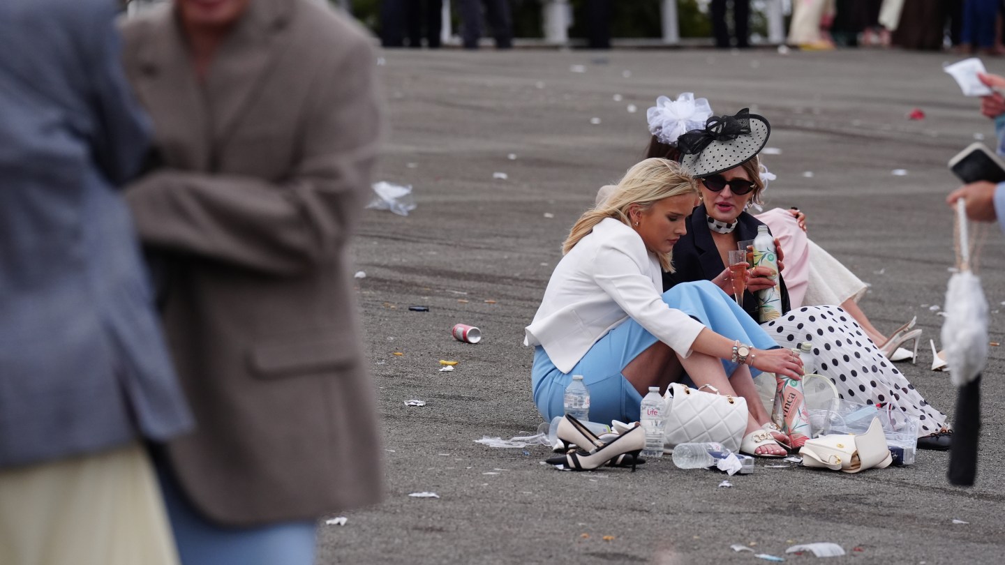 Racegoers at the end of Ladies Day of the Randox Grand National Festival 2026 at Aintree Racecourse.