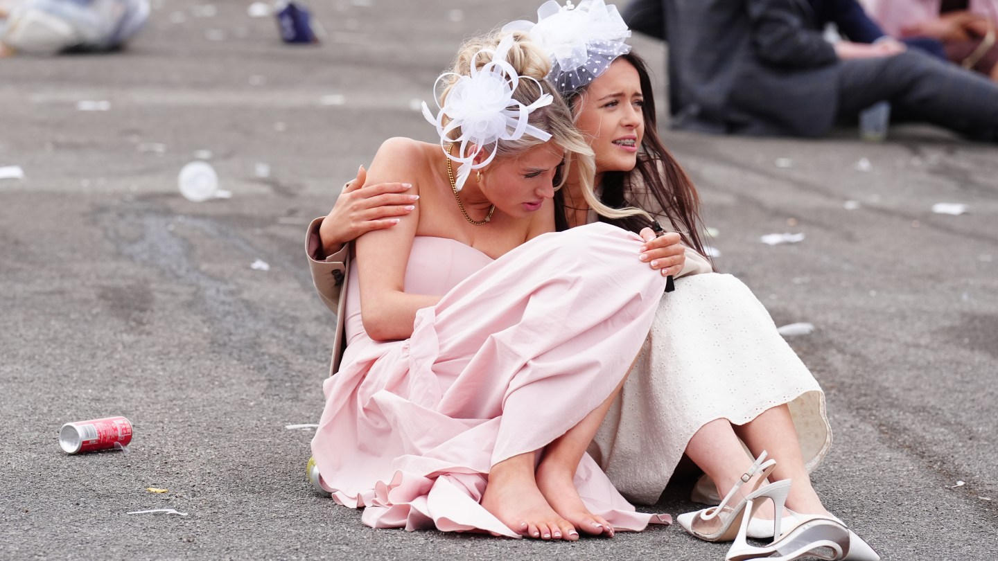 Racegoers at the end of Ladies Day of the Randox Grand National Festival 2026 at Aintree Racecourse.