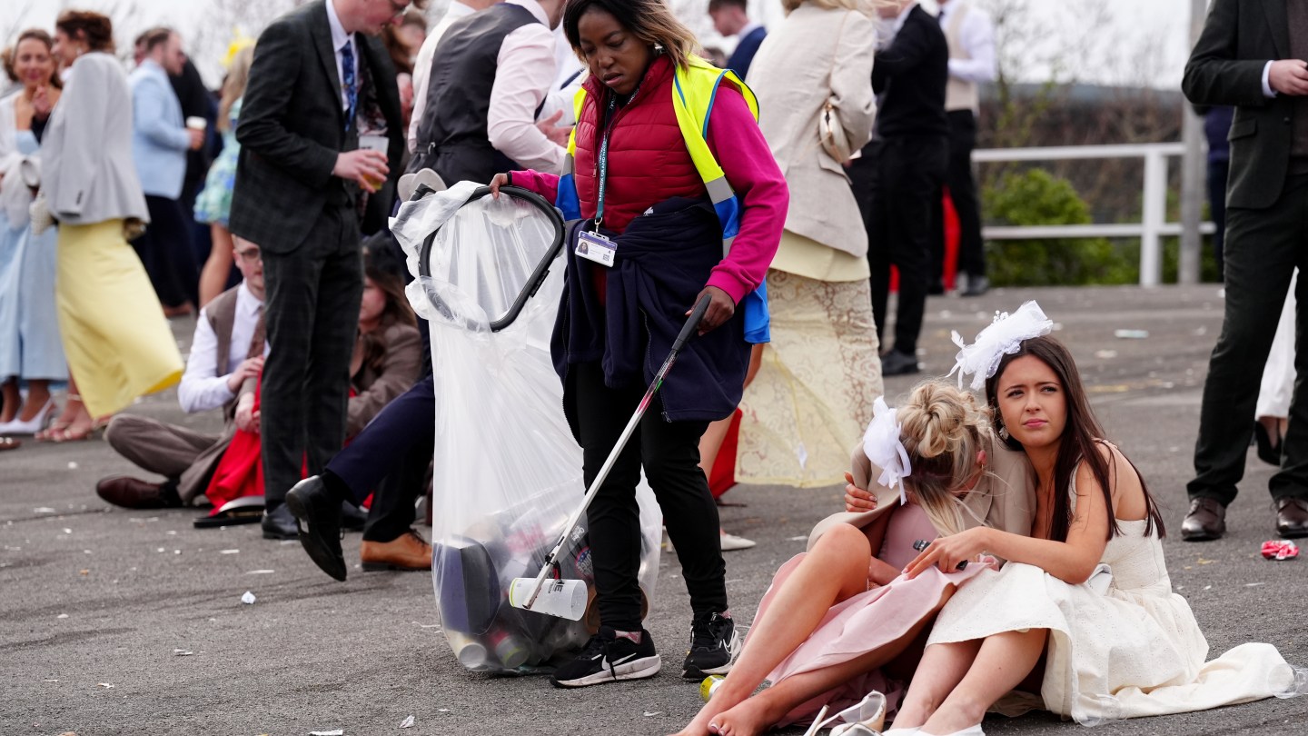 Racegoers at the end of Ladies Day of the Randox Grand National Festival 2026 at Aintree Racecourse.