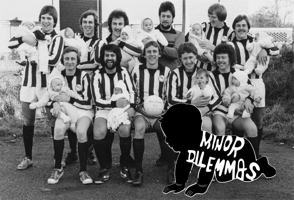 A group of British football-playing dads in the 1980s, wearing their uniforms and holding their infant children while posing for a picture. Includes the "minor dilemmas" logo of a black outline of a crawling baby