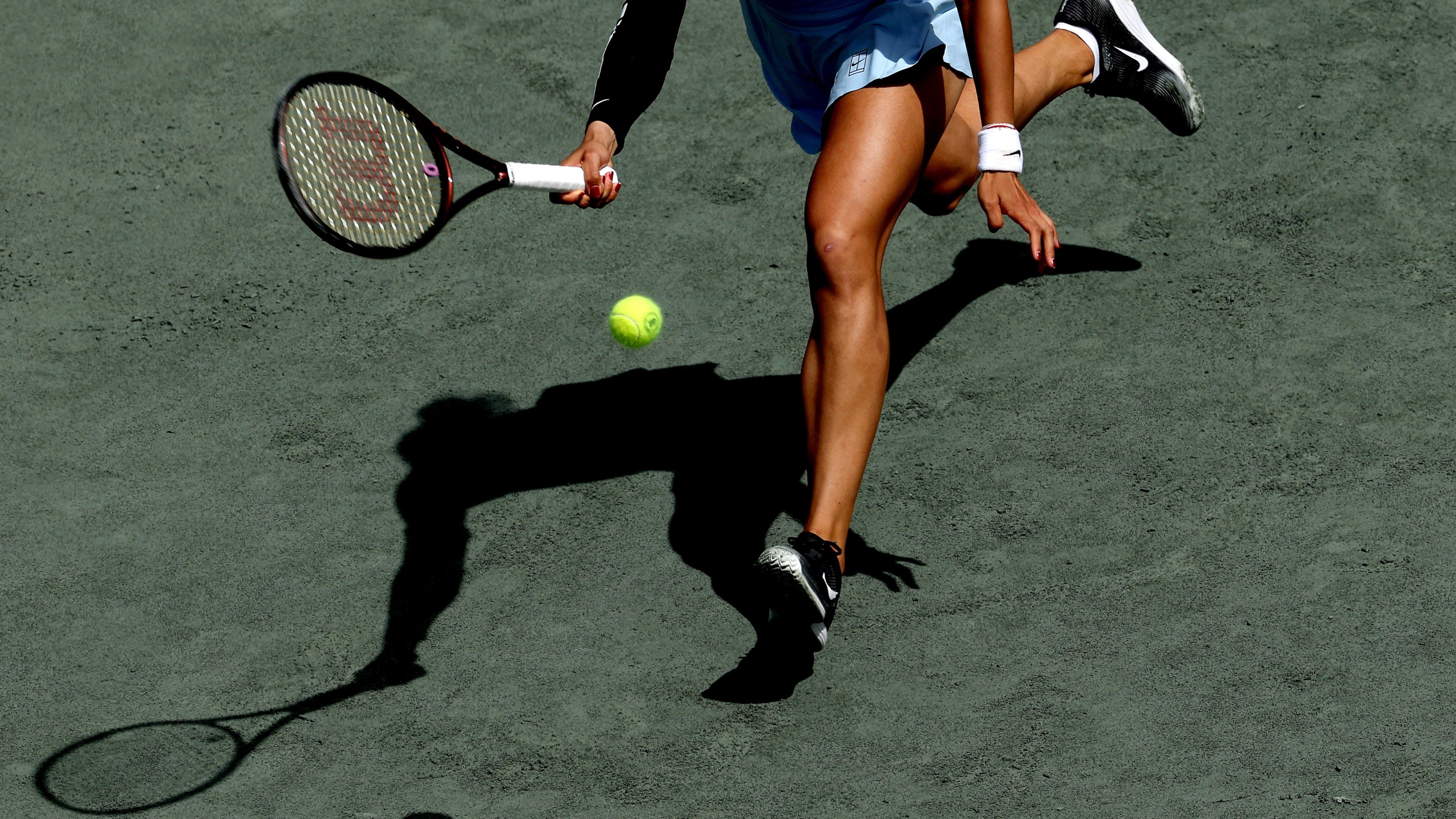 Qinwen Zheng of China returns a shot to Ekaterina Alexandrova during the Credit One Charleston Open at Credit One Stadium on April 04, 2025 in Charleston, South Carolina. (Photo by Matthew Stockman/Getty Images)