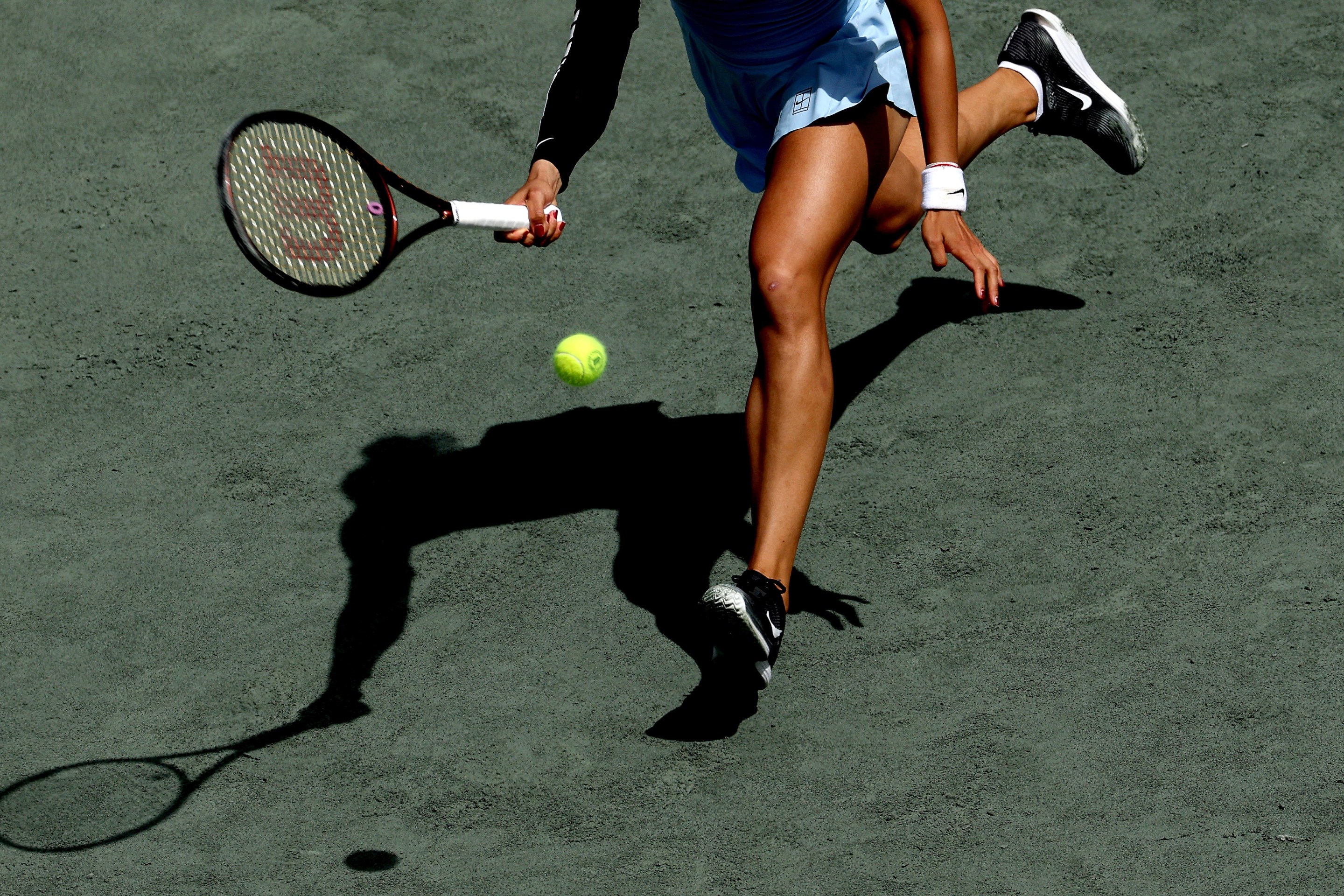 Qinwen Zheng of China returns a shot to Ekaterina Alexandrova during the Credit One Charleston Open at Credit One Stadium on April 04, 2025 in Charleston, South Carolina. (Photo by Matthew Stockman/Getty Images)