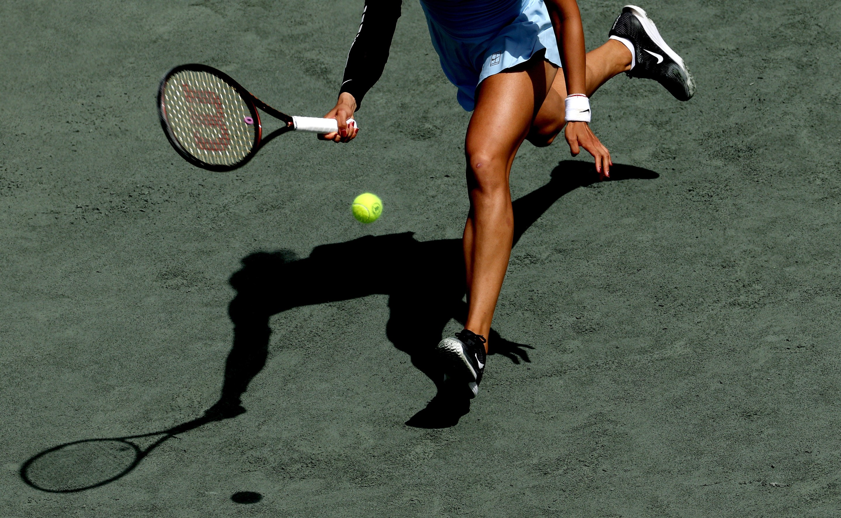 Qinwen Zheng of China returns a shot to Ekaterina Alexandrova during the Credit One Charleston Open at Credit One Stadium on April 04, 2025 in Charleston, South Carolina. (Photo by Matthew Stockman/Getty Images)