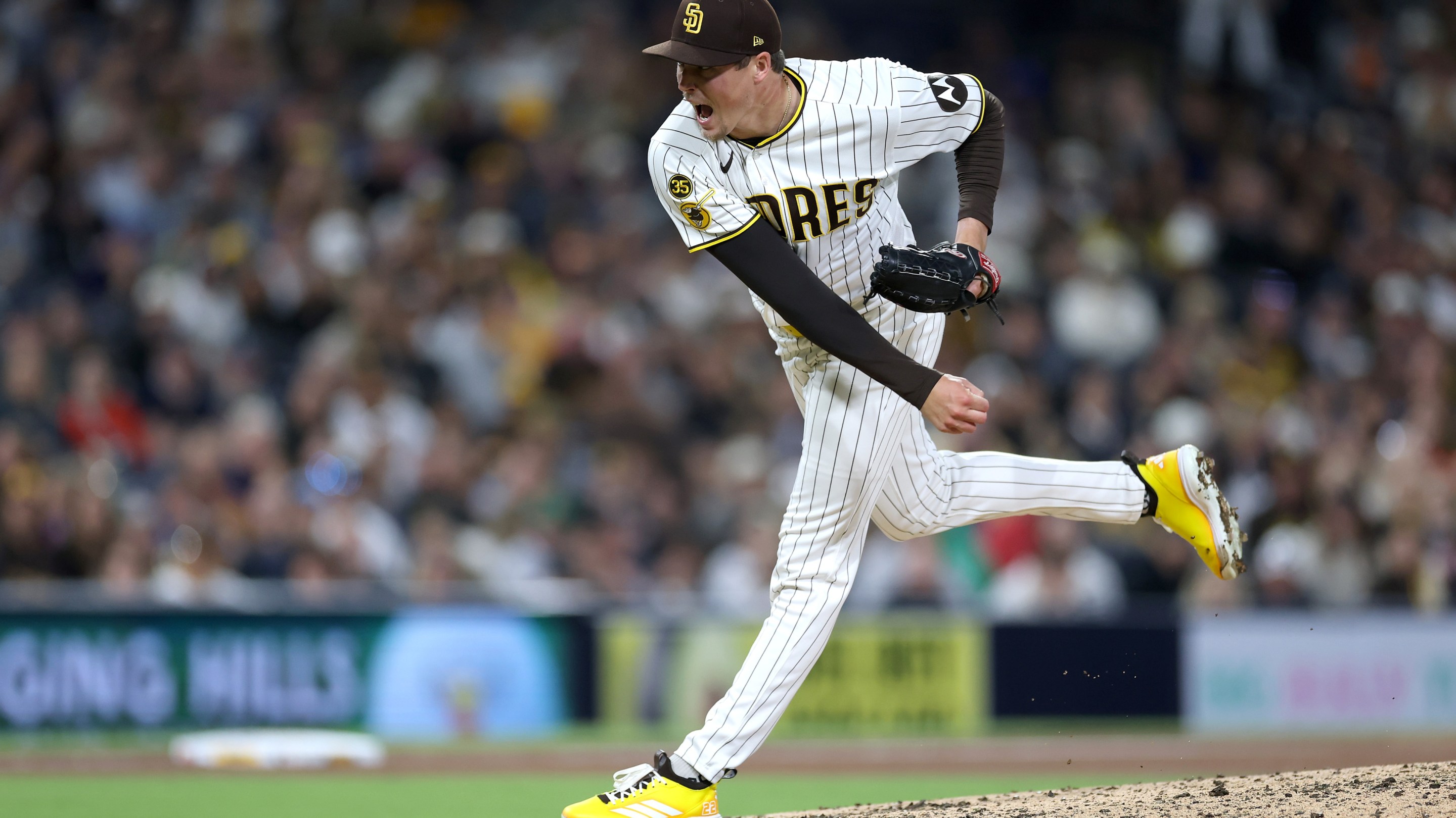 14: Mason Miller #22 of the San Diego Padres pitches during the ninth inning.