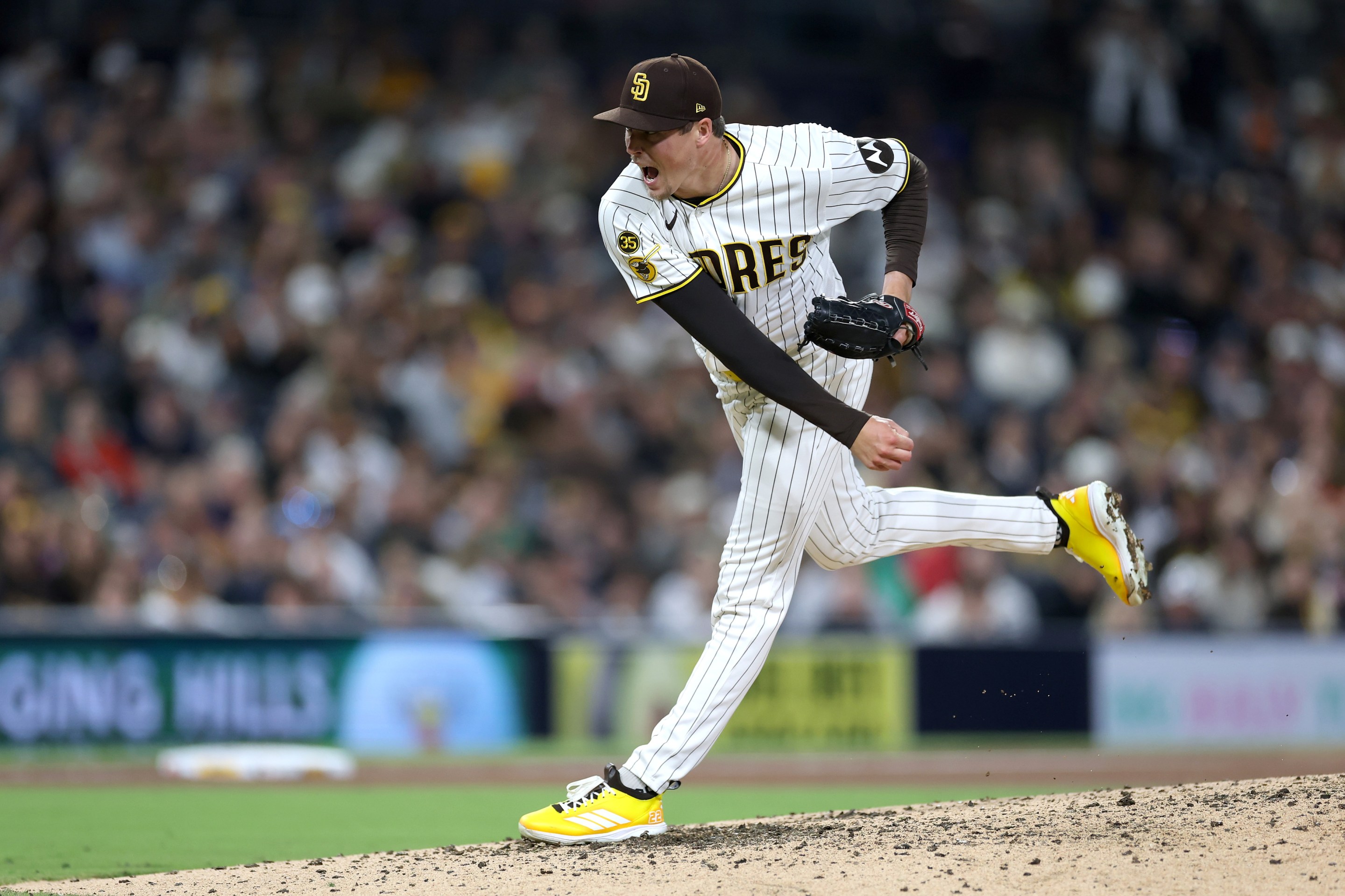 14: Mason Miller #22 of the San Diego Padres pitches during the ninth inning.