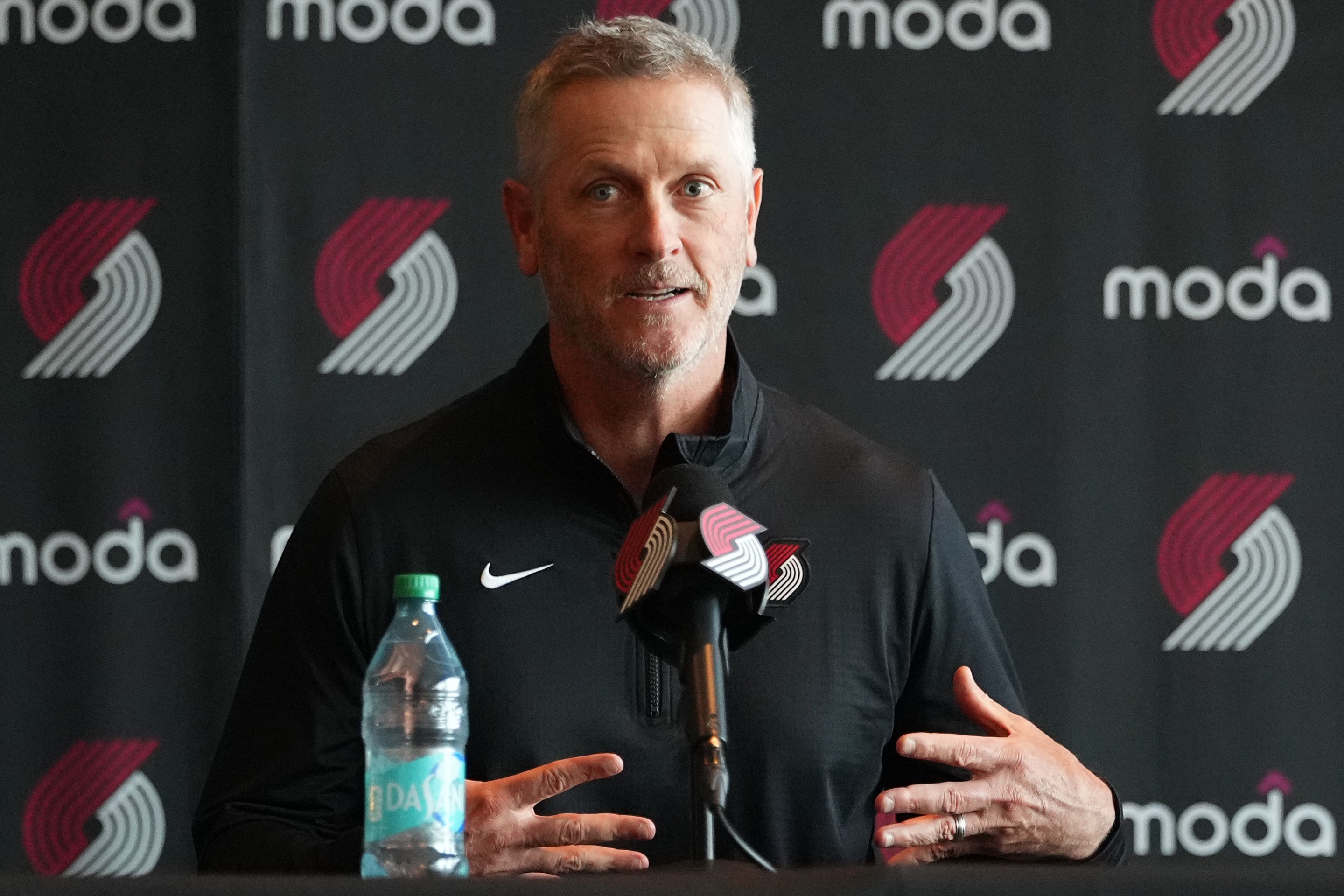 Tom Dundon, Portland Trail Blazers owner (C), speaks as alternate governors Sheel Tyle (L) and Andrew Cherng (R) listen during a press conference before a game against the New Orleans Pelicans at Moda Center on April 02, 2026 in Portland, Oregon. NOTE TO USER: User expressly acknowledges and agrees that, by downloading and or using this photograph, User is consenting to the terms and conditions of the Getty Images License Agreement. (Photo by Soobum Im/Getty Images)