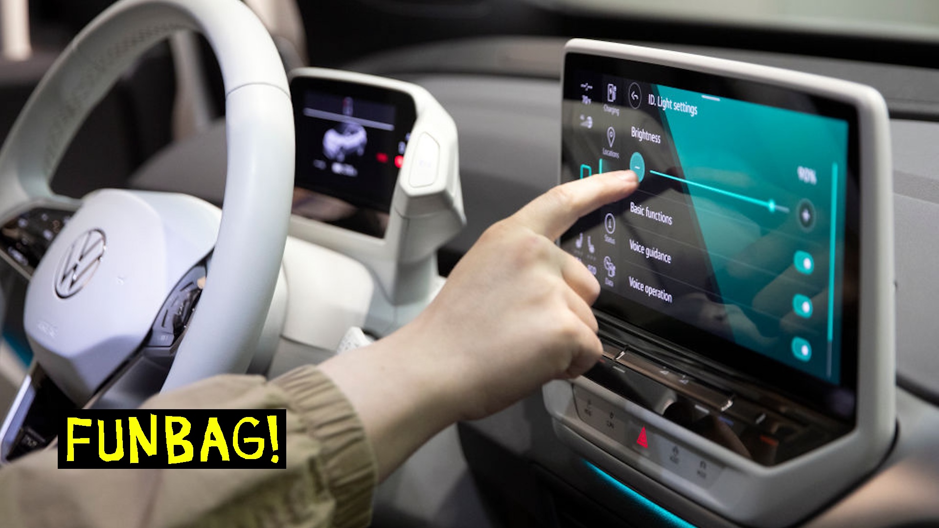 A man tests the new touchscreen inside the new all-electric Volkswagen ID.4 that is on display inside a dealership