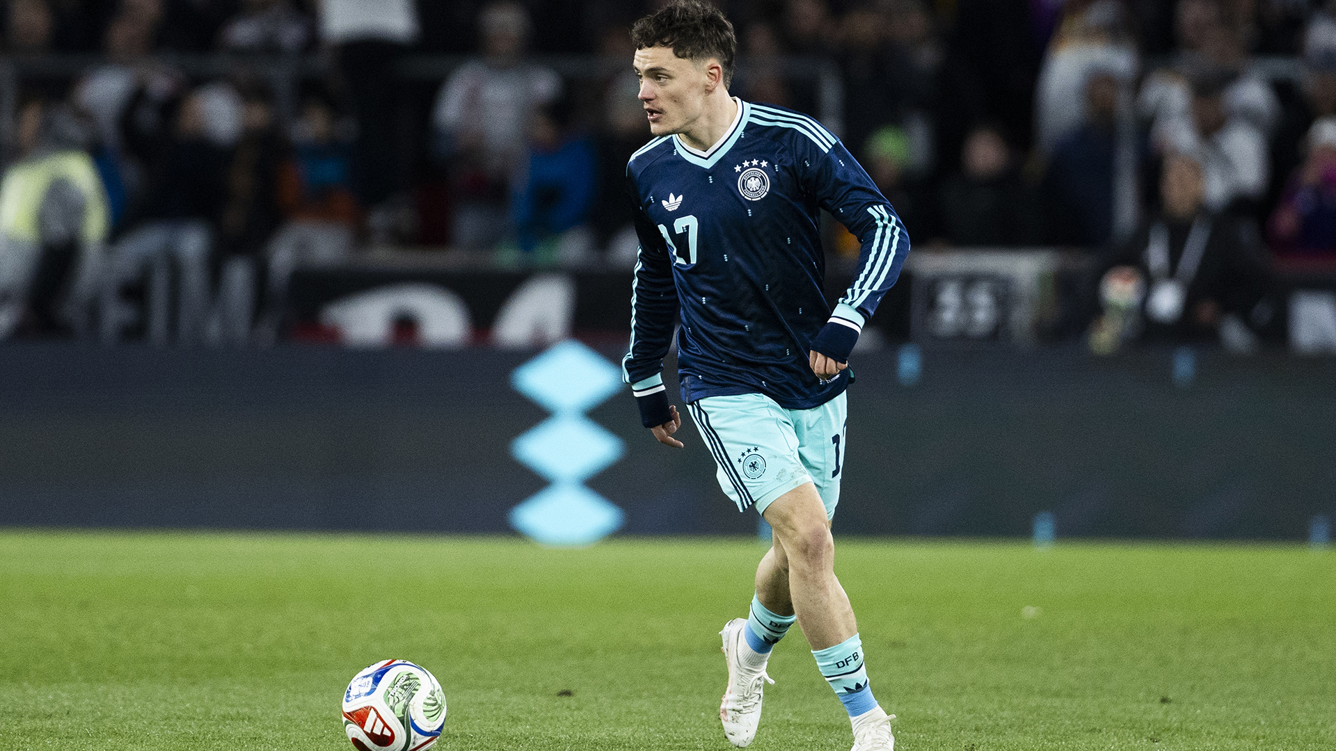 Florian Wirtz of Germany runs with the ball during the international friendly match between Germany and Ghana at MHP Arena on March 30, 2026 in Stuttgart, Germany.