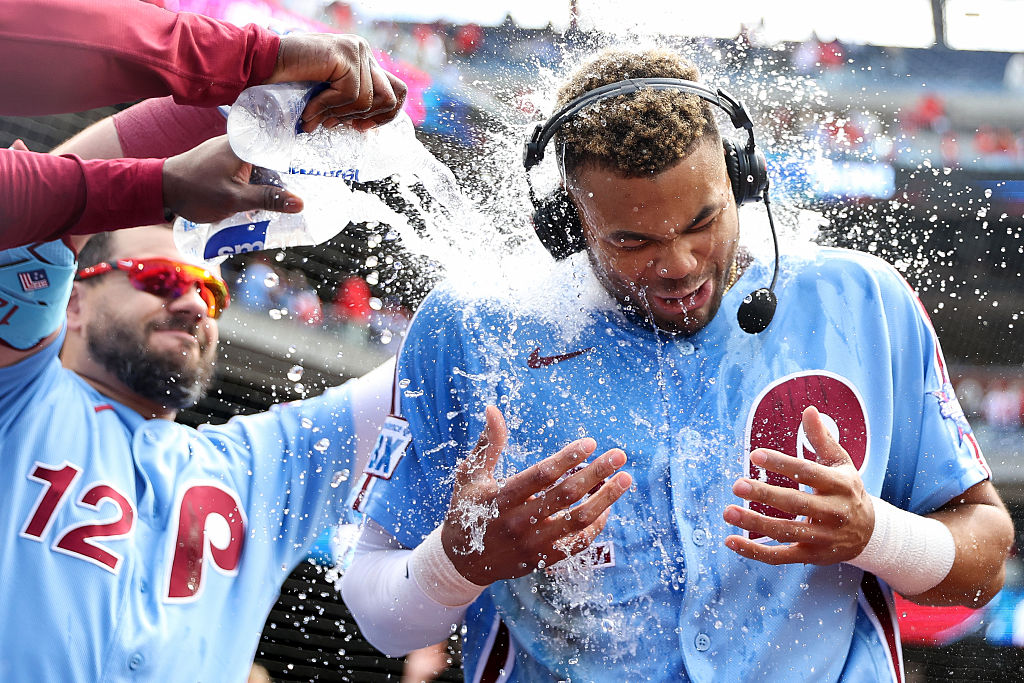 Justin Crawford, in the powder blue jersey, gets drenched in water after a walk-off win!