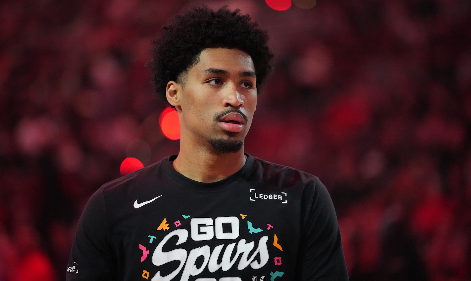 PORTLAND, OREGON - APRIL 26: Dylan Harper #2 of the San Antonio Spurs looks on prior to Game Four of the Western Conference First Round Playoffs against the Portland Trail Blazers at Moda Center on April 26, 2026 in Portland, Oregon. NOTE TO USER: User expressly acknowledges and agrees that, by downloading and or using this photograph, User is consenting to the terms and conditions of the Getty Images License Agreement. (Photo by Soobum Im/Getty Images)