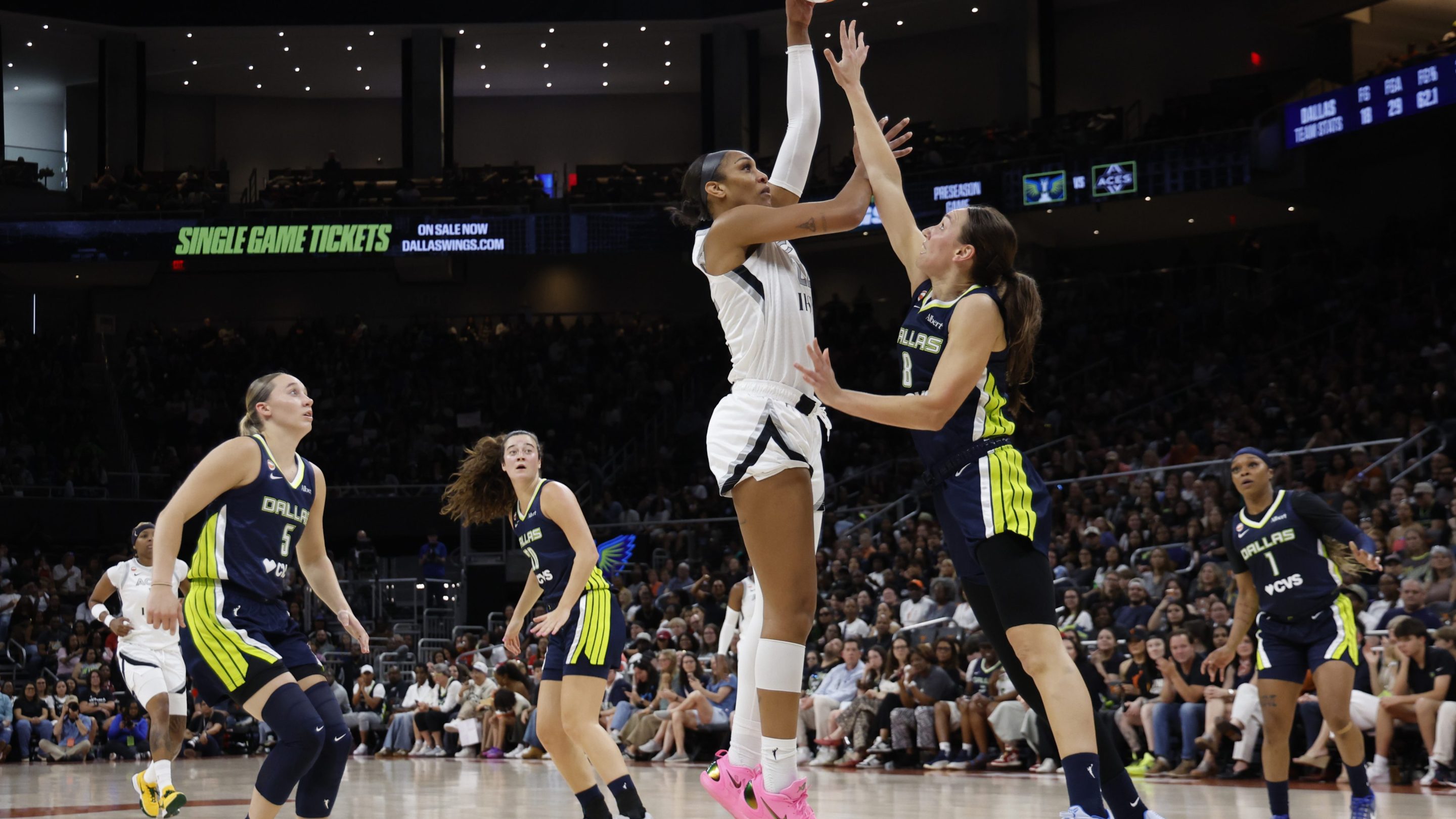 A'ja Wilson #22 of the Las Vegas Aces shoots over Alanna Smith #8 of the Dallas Wings