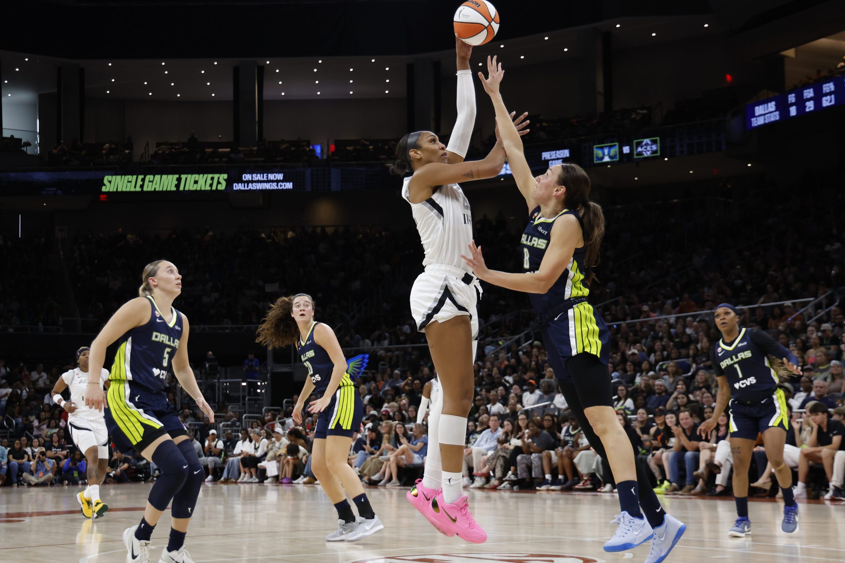 A'ja Wilson #22 of the Las Vegas Aces shoots over Alanna Smith #8 of the Dallas Wings