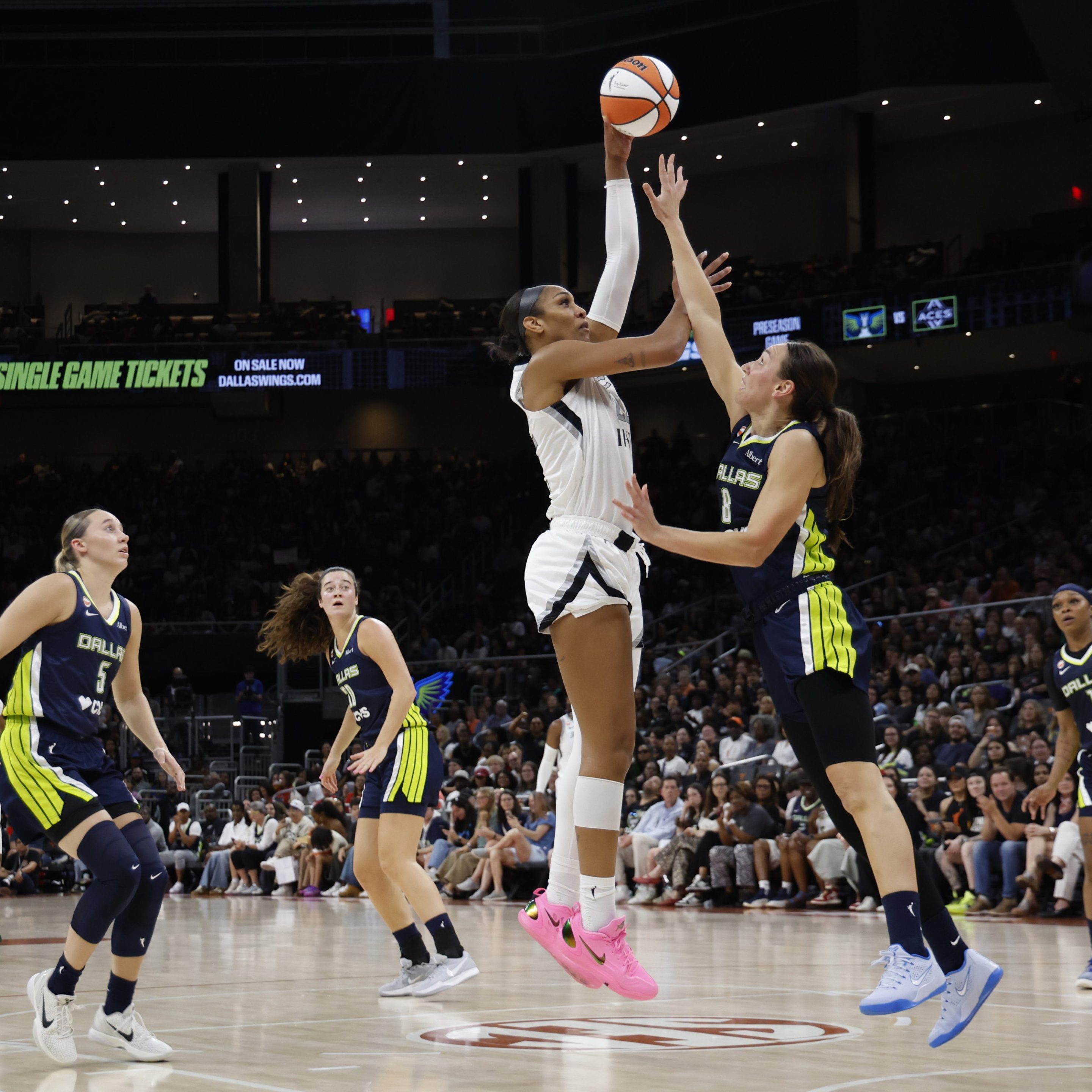A'ja Wilson #22 of the Las Vegas Aces shoots over Alanna Smith #8 of the Dallas Wings