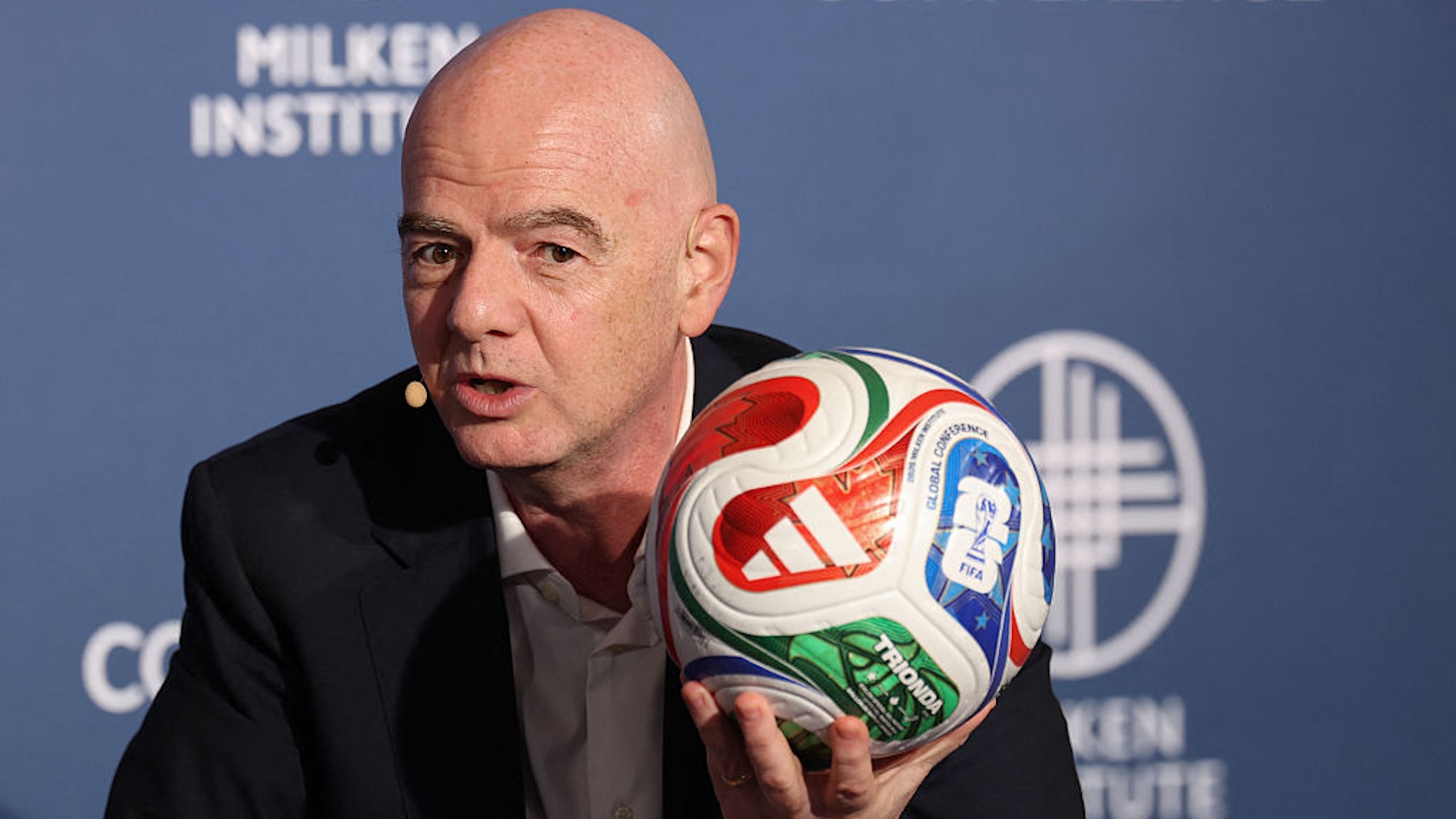 Gianni Infantino holds a soccer ball